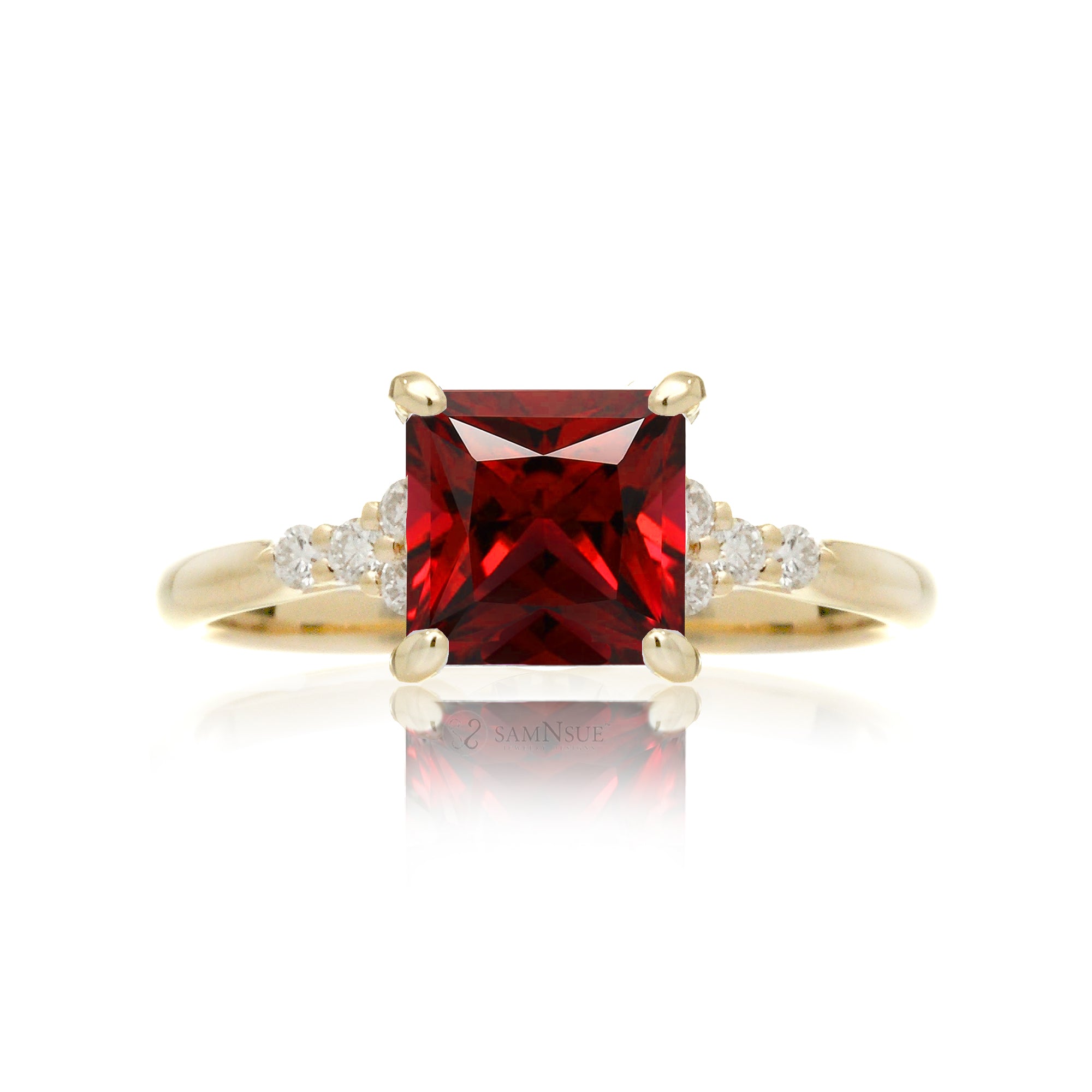 Ruby ring with princess cut and diamond accent in yellow gold