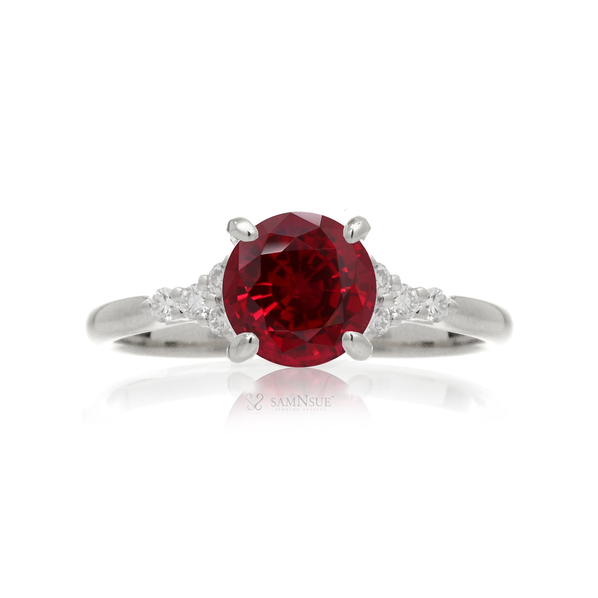 Round cut ruby three stone diamond ring in white gold