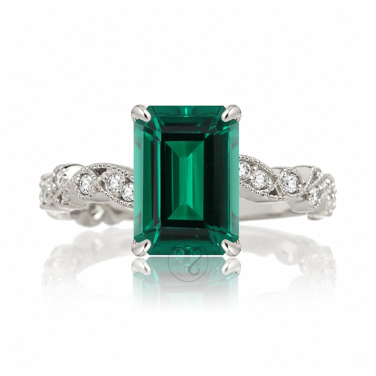 The Elara Step Cut Emerald Ring