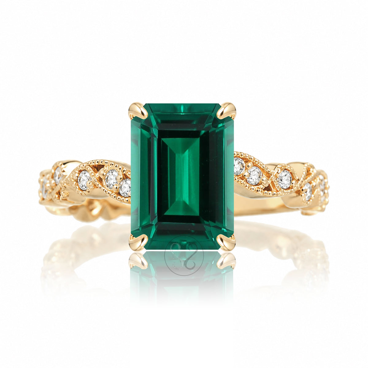 The Elara Step Cut Emerald Ring