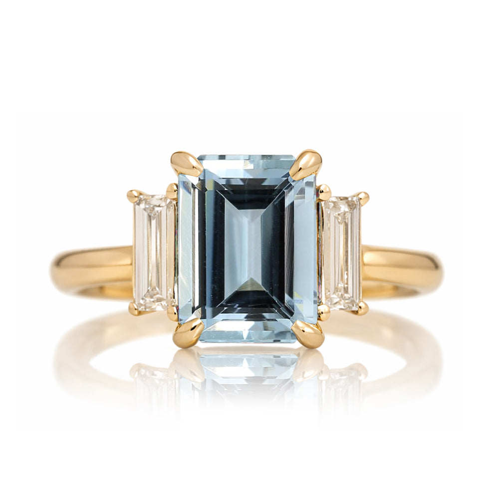 Emerald cut aquamarine ring with long baguette three stone solid comfort fit rounded band yellow gold