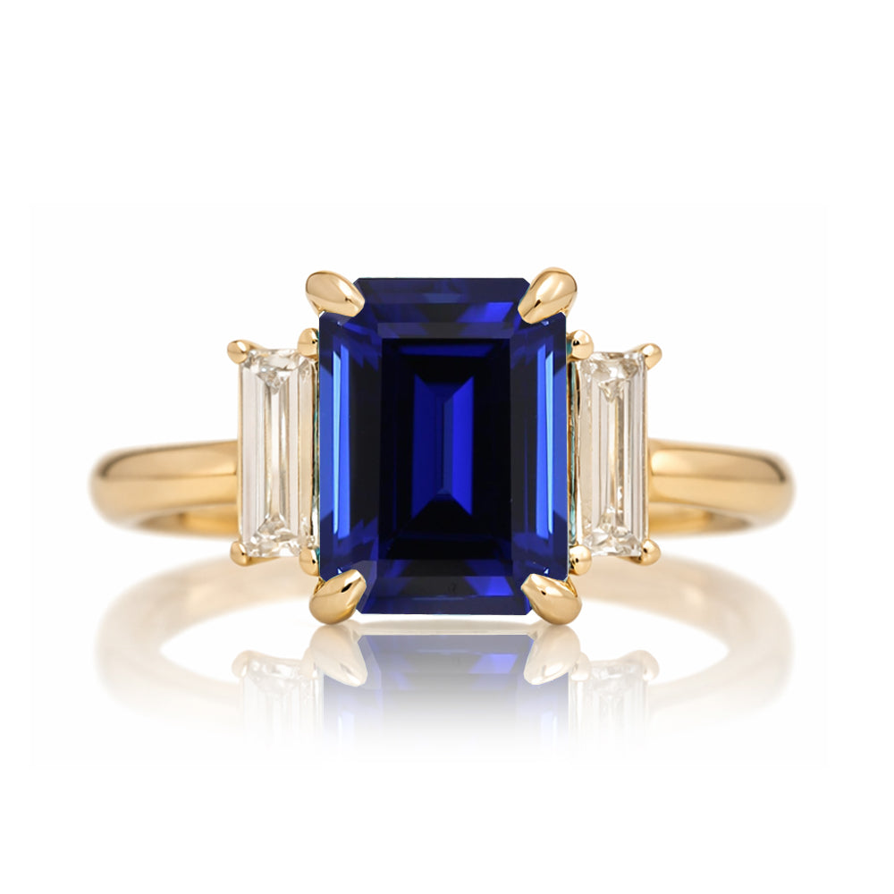 Emerald cut blue sapphire ring with long baguette three stone solid comfort fit rounded band yellow gold