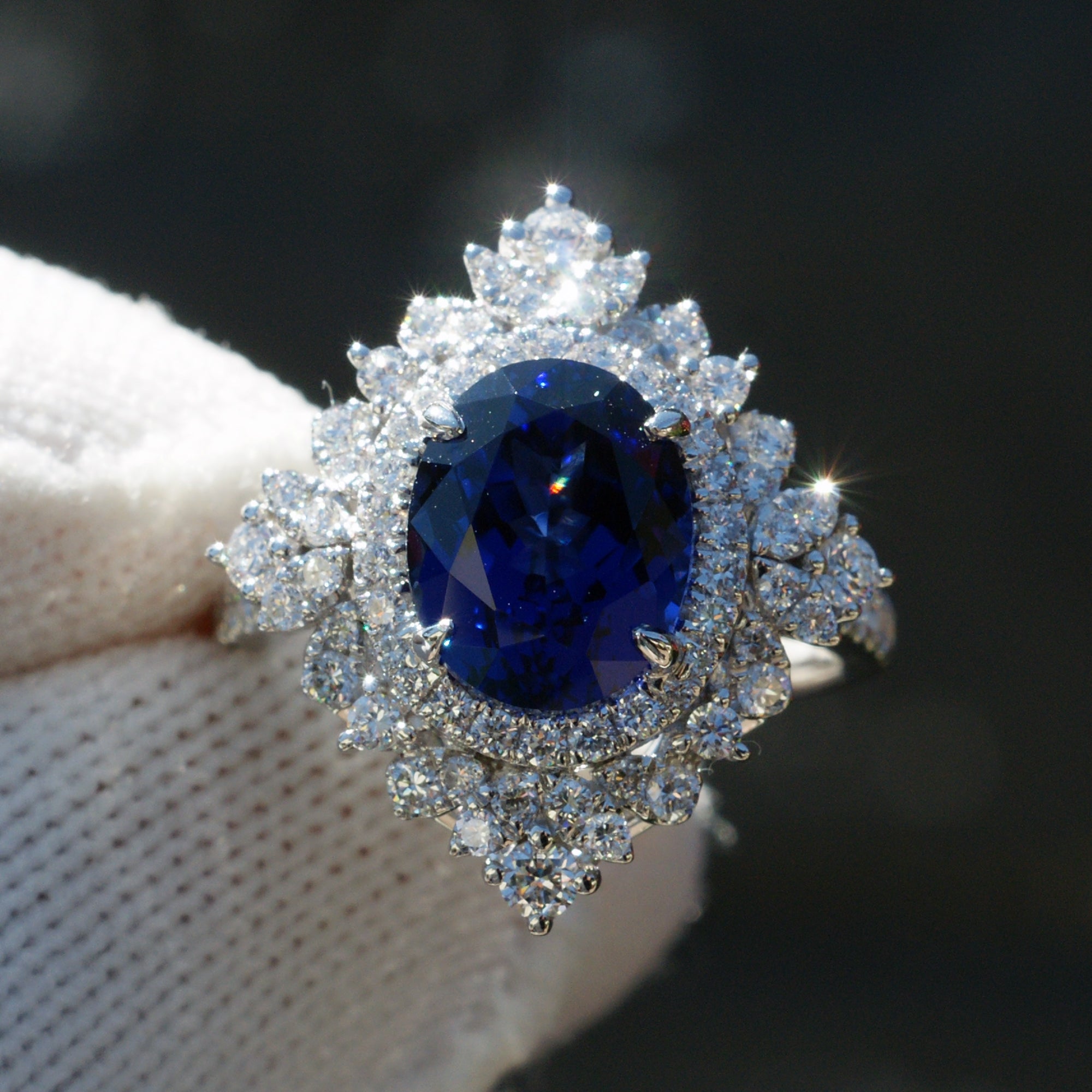 Kate's oval blue sapphire ring with diamond halo in white gold