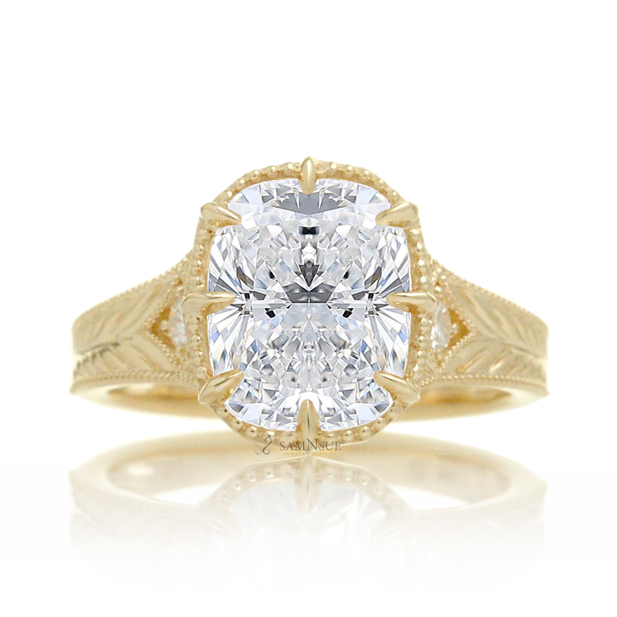 A cushion old mine cut diamond glimmers at the heart of this vintage-inspired engagement ring, set in polished yellow gold. The detailed band features hand-carved artistry, enhancing the antique character and timeless appeal.