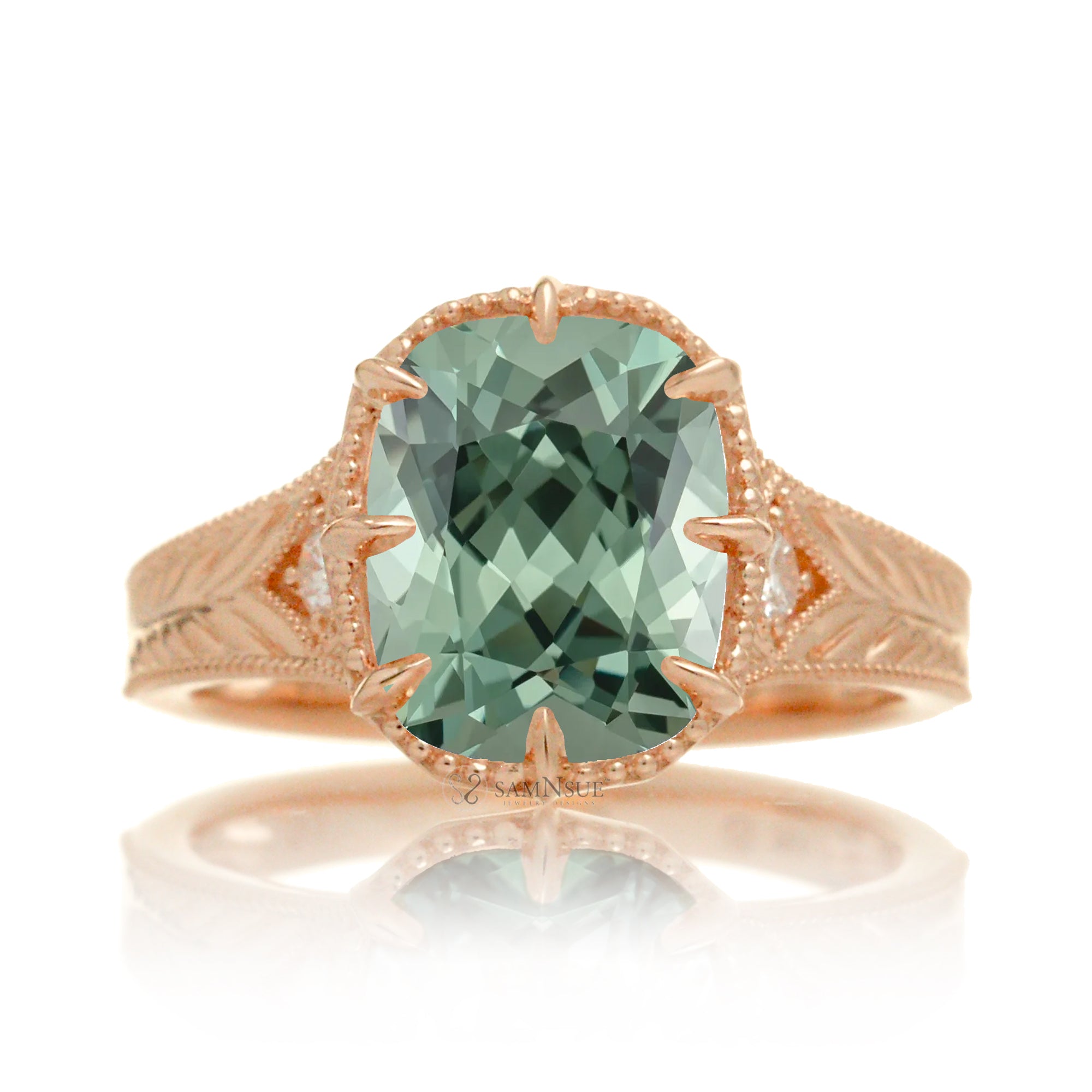 The Kelcey is a vintage-inspired green sapphire ring showcasing a cushion cut green sapphire, admired for its rich, vibrant green brilliance.