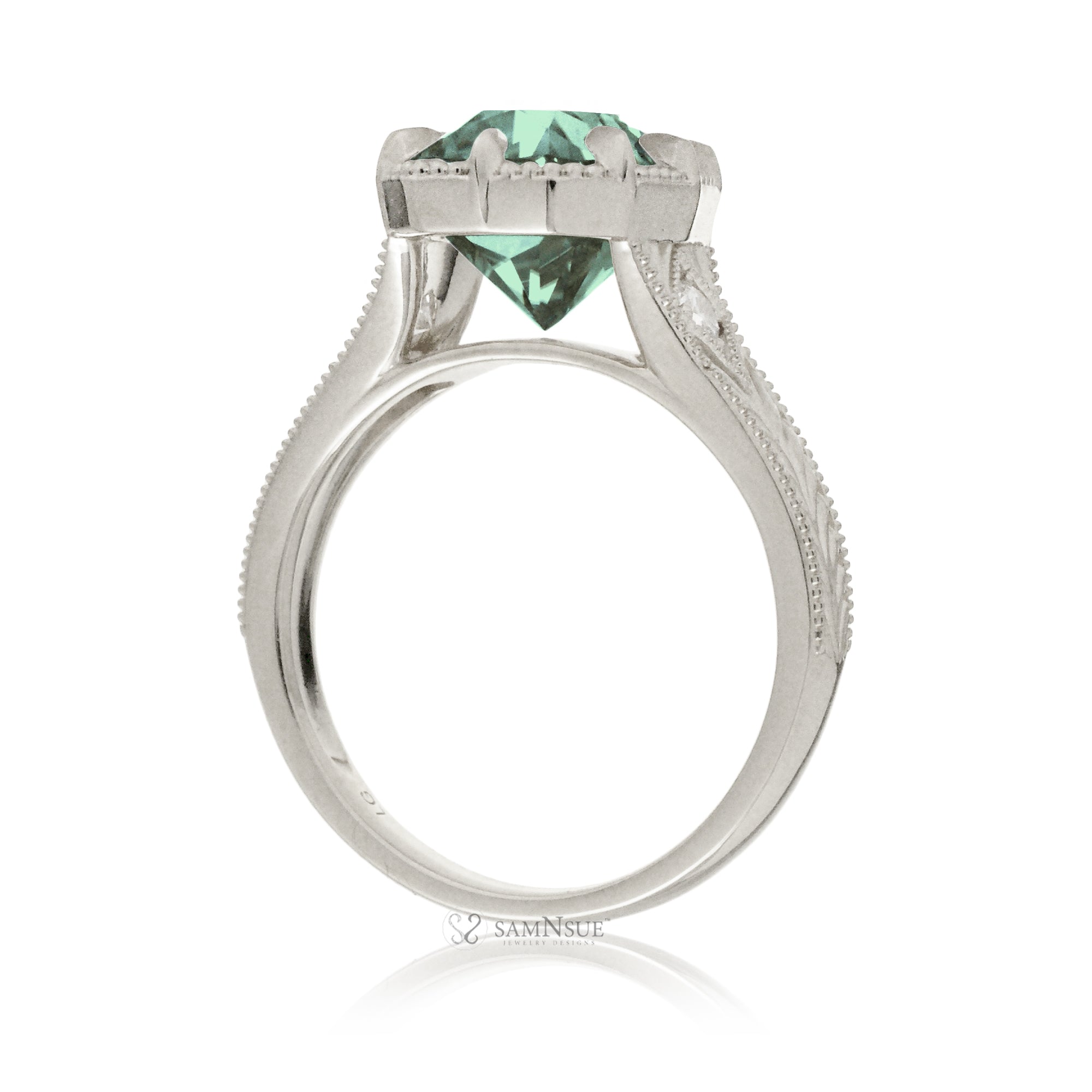 The Kelcey is a vintage-inspired green sapphire ring showcasing a cushion cut green sapphire, admired for its rich, vibrant green brilliance.