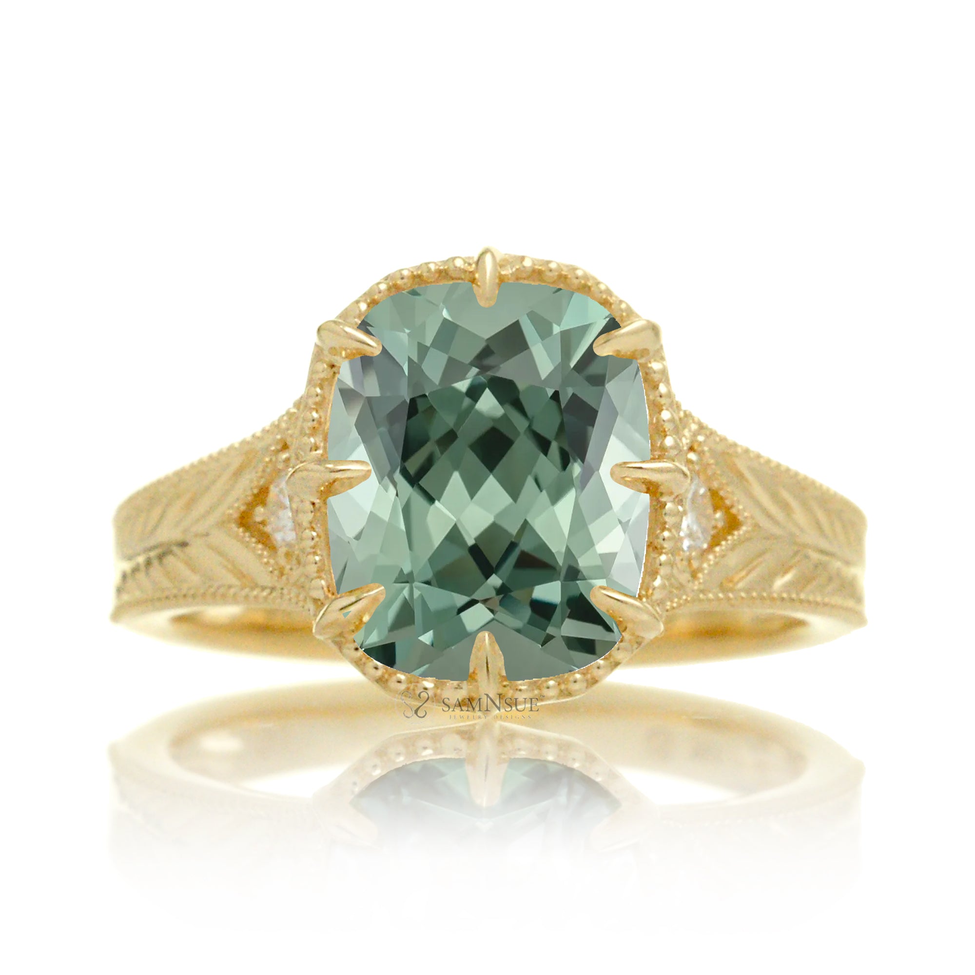 The Kelcey is a vintage-inspired green sapphire ring showcasing a cushion cut green sapphire, admired for its rich, vibrant green brilliance.
