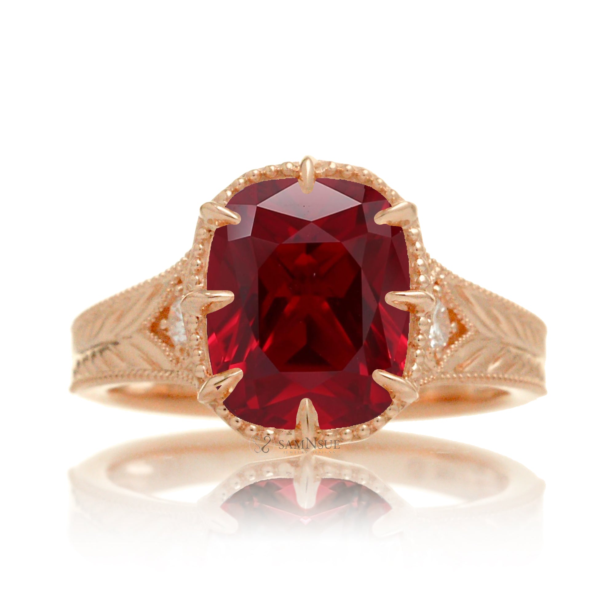 An elegant cushion cut ruby takes center stage in this vintage-style ring. The rich designed rose gold band, adorned with delicate detailing, highlights the diamond’s fire and evokes a sense of classic, enduring romance.