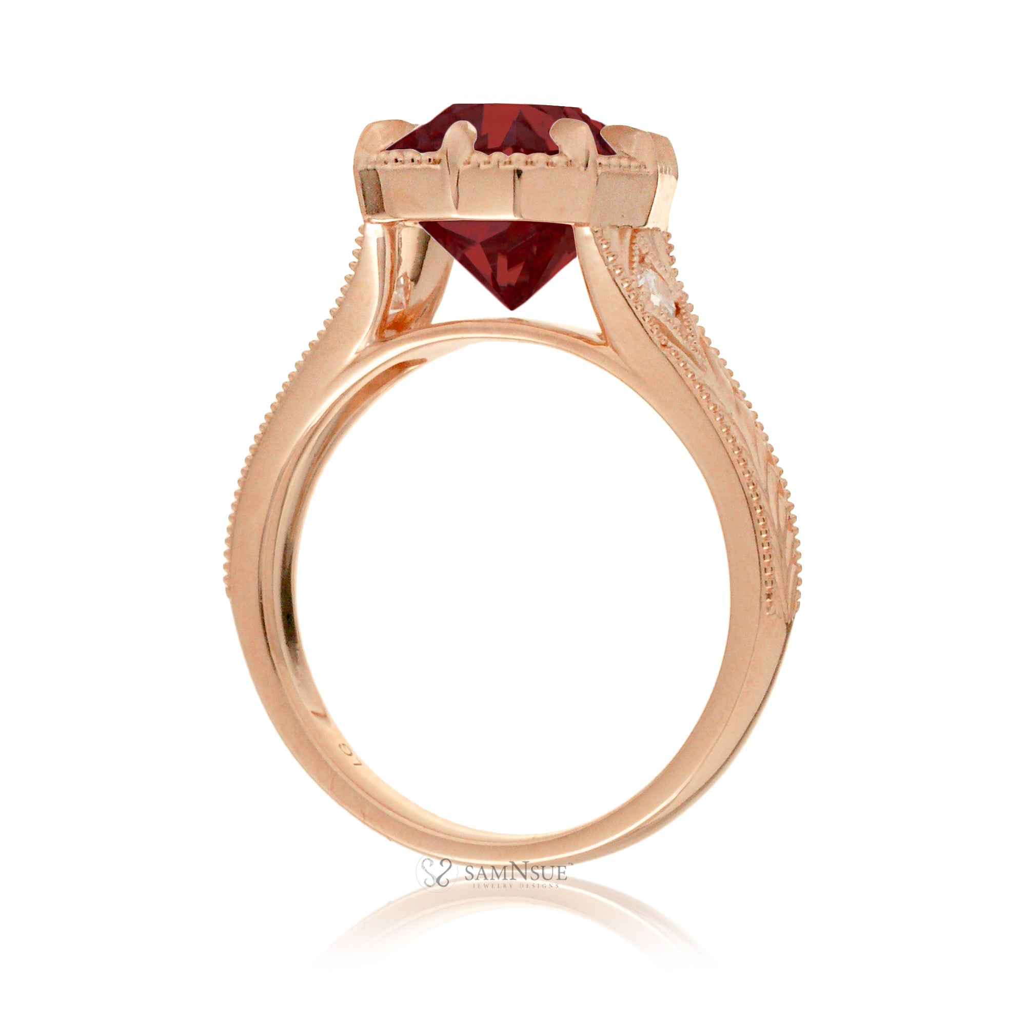 An elegant cushion cut ruby takes center stage in this vintage-style ring. The rich designed rose gold band, adorned with delicate detailing, highlights the diamond’s fire and evokes a sense of classic, enduring romance.