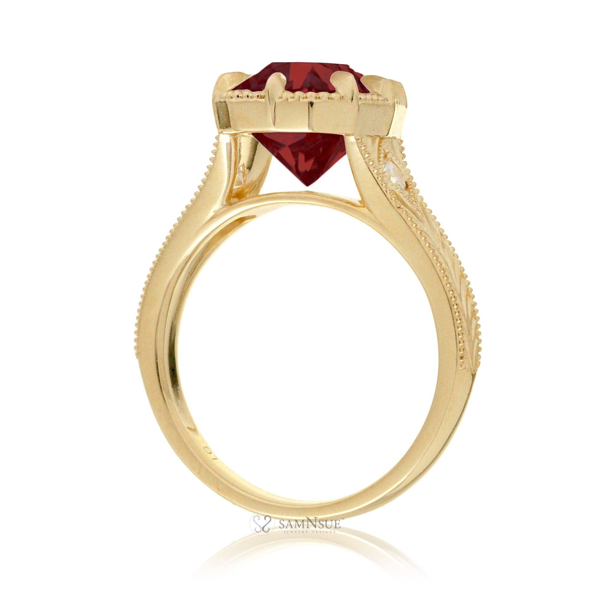 An elegant cushion cut ruby takes center stage in this vintage-style ring. The rich designed yellow gold band, adorned with delicate detailing, highlights the diamond’s fire and evokes a sense of classic, enduring romance.
