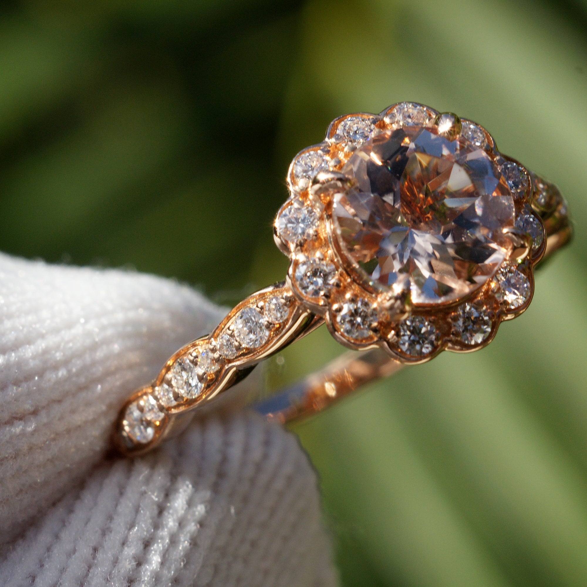 Round morganite ring with diamond halo on a scallop vintage setting rose gold
