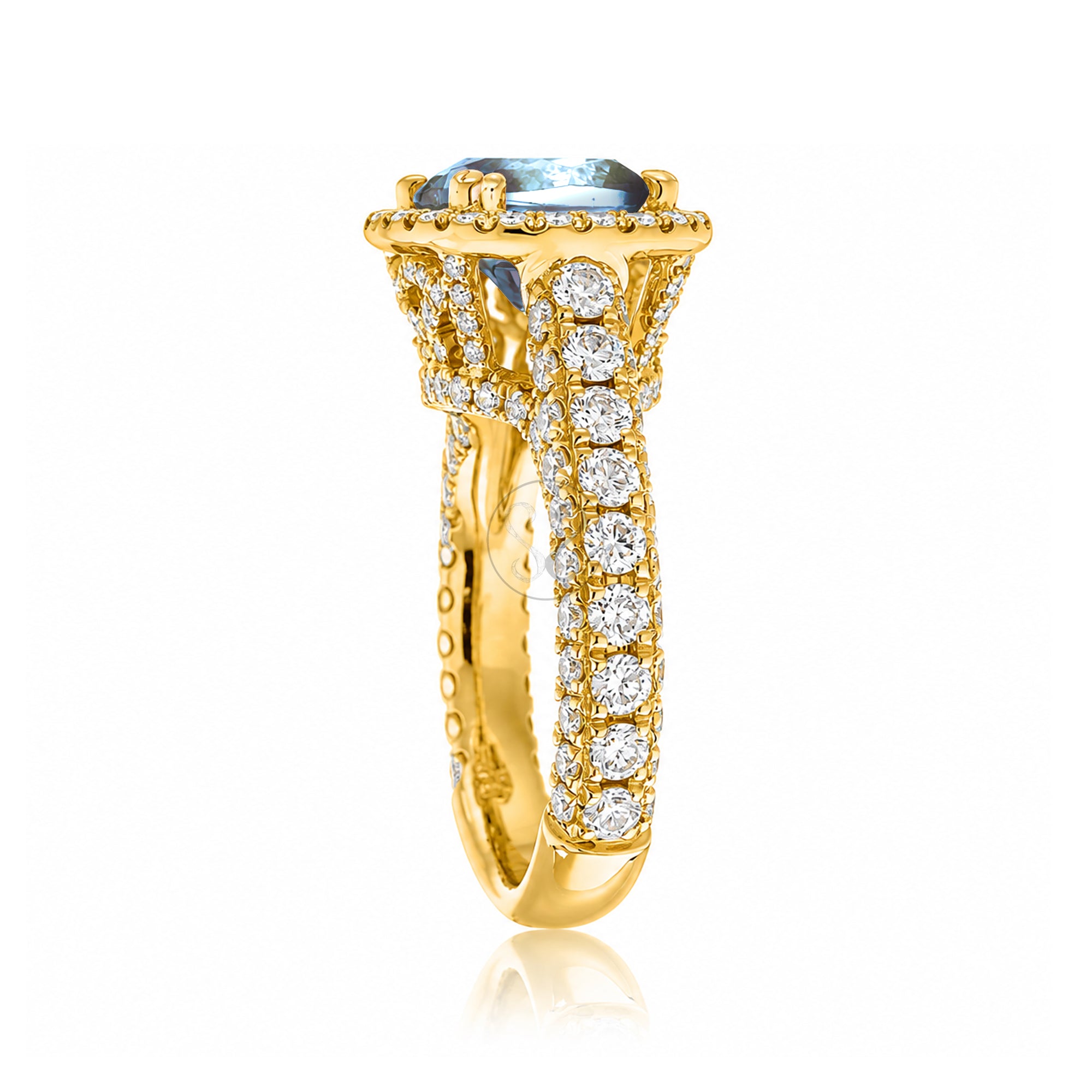 Cushion-cut aquamarine engagement ring in yellow gold with diamond halo and pavé diamond shoulders The Tamara