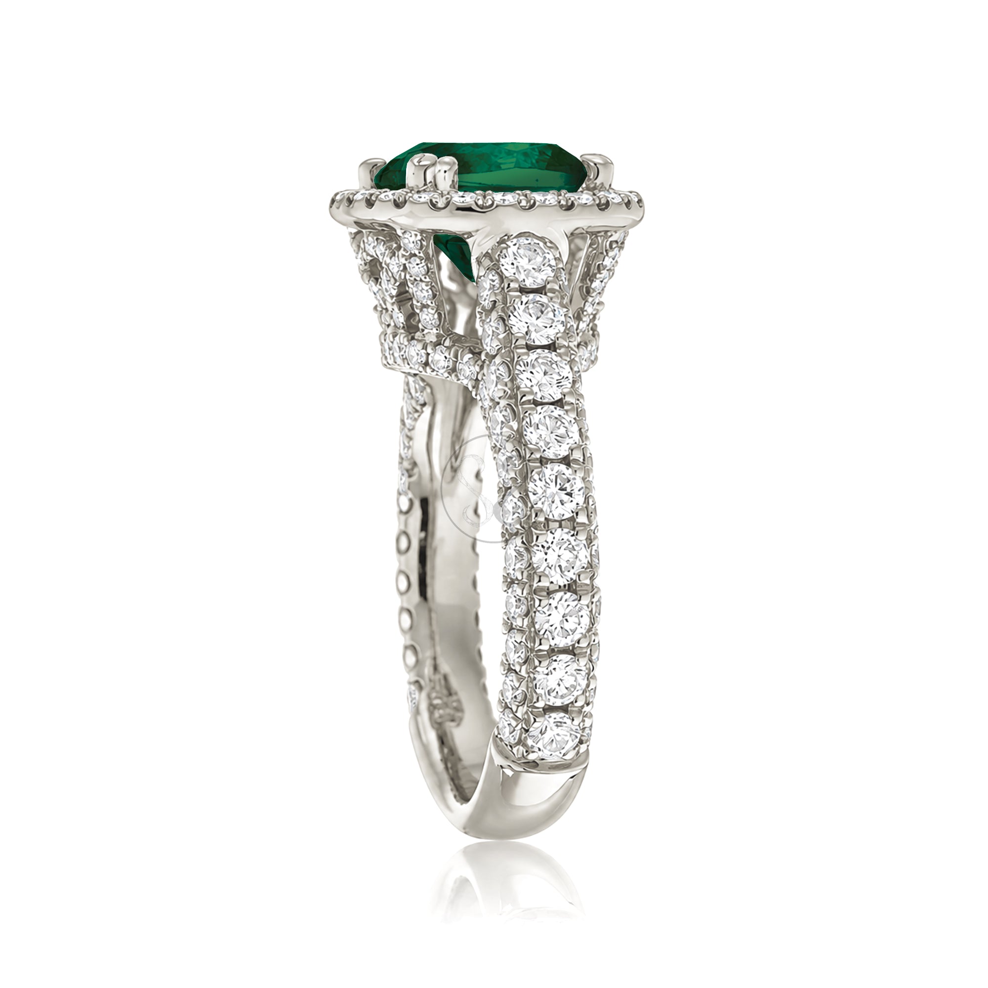 Cushion-cut emerald engagement ring in white gold with diamond halo and pavé diamond shoulders The Tamara