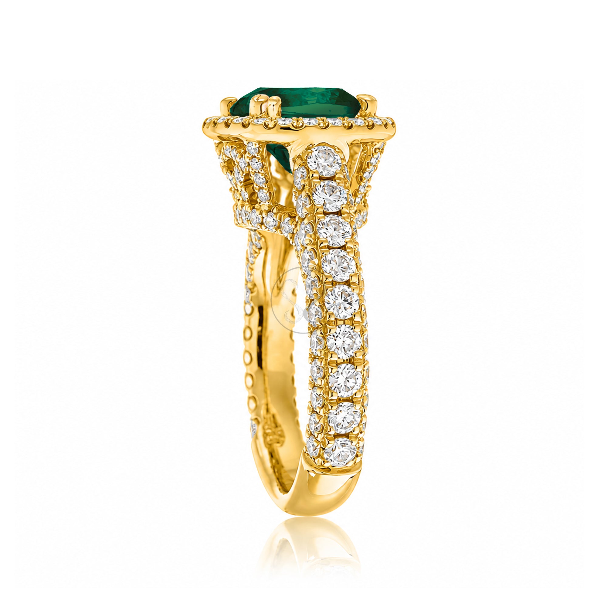 Cushion-cut emerald engagement ring in yellow gold with diamond halo and pavé diamond shoulders The Tamara