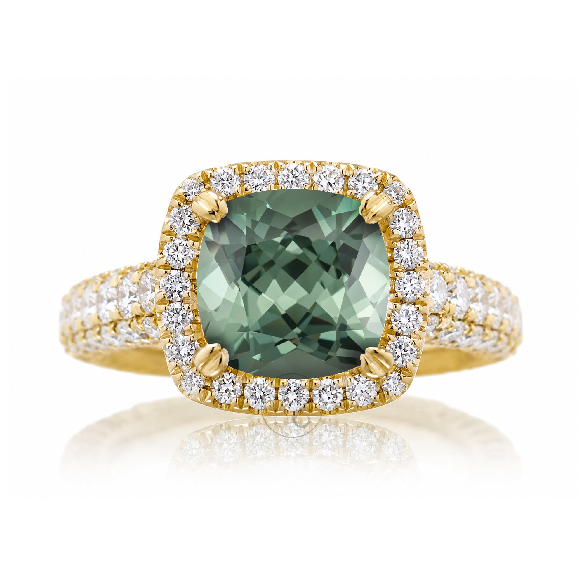Cushion-cut green sapphire engagement ring in yellow gold with diamond halo and pavé diamond shoulders