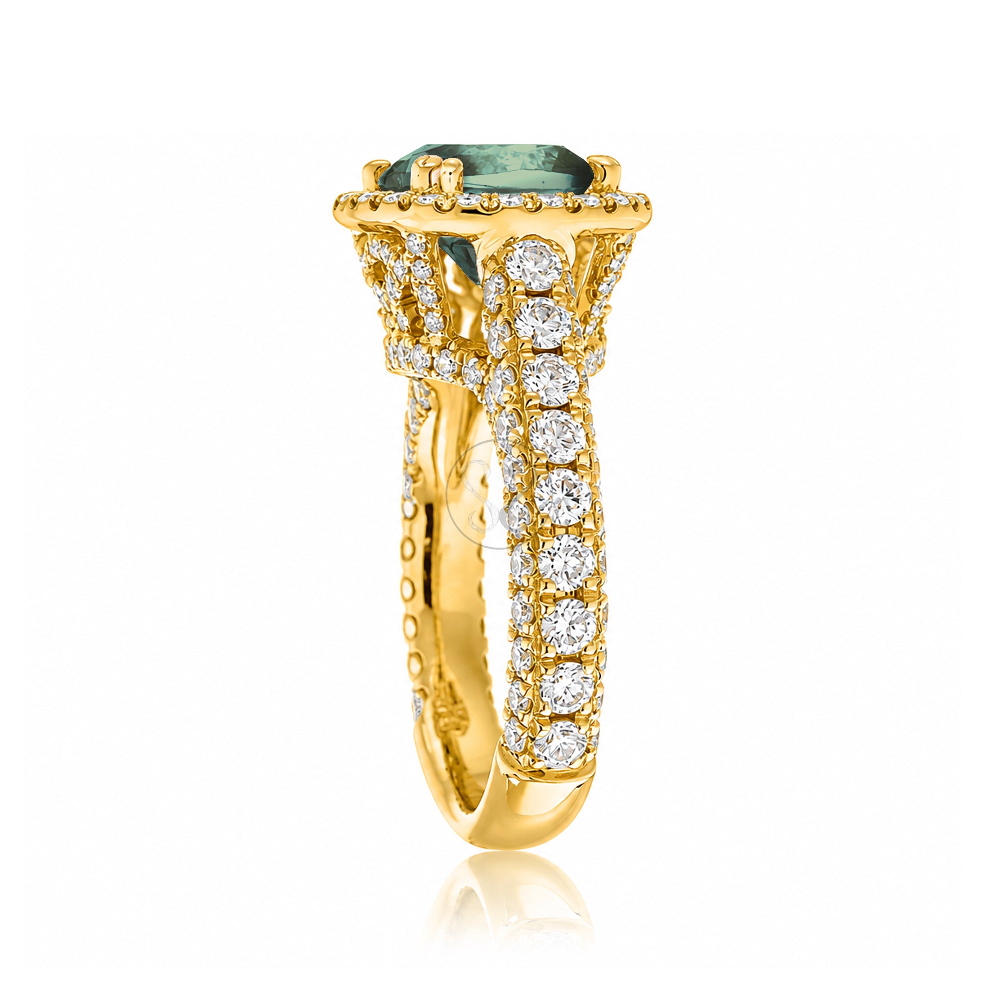 Cushion-cut green sapphire engagement ring in yellow gold with diamond halo and pavé diamond shoulders