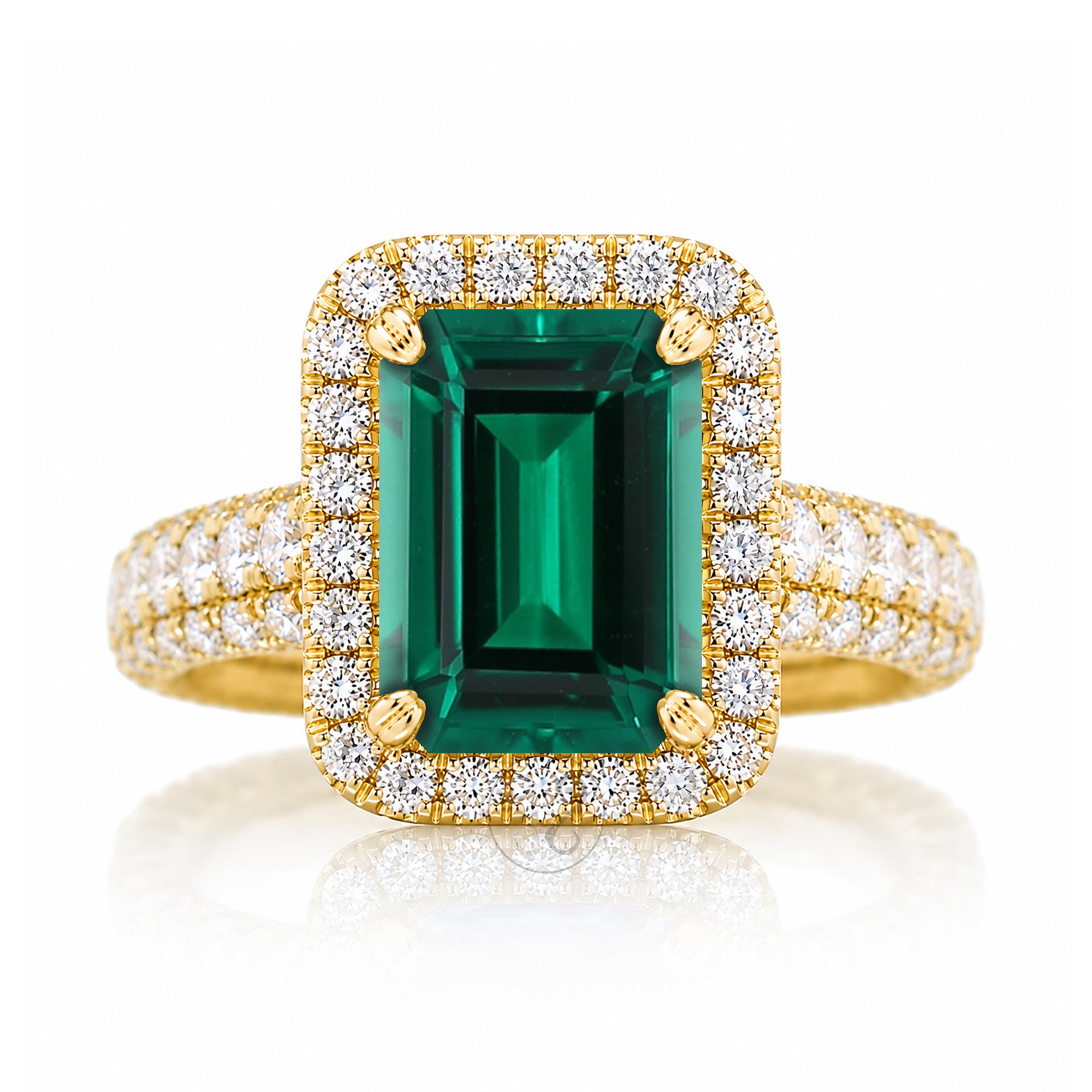 An emerald-cut green gemstone ring with a rose gold halo and diamond-set band three dimensional diamond band thick and bold yellow gold