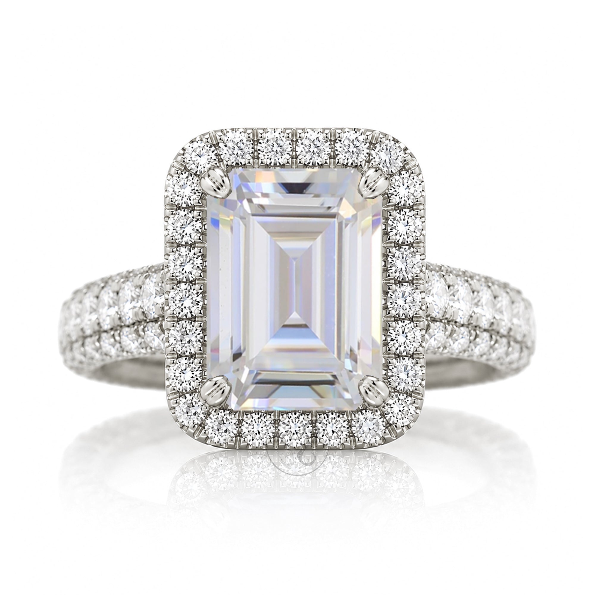 Moissanite emerald cut diamond halo and large three dimensional wide band in white gold