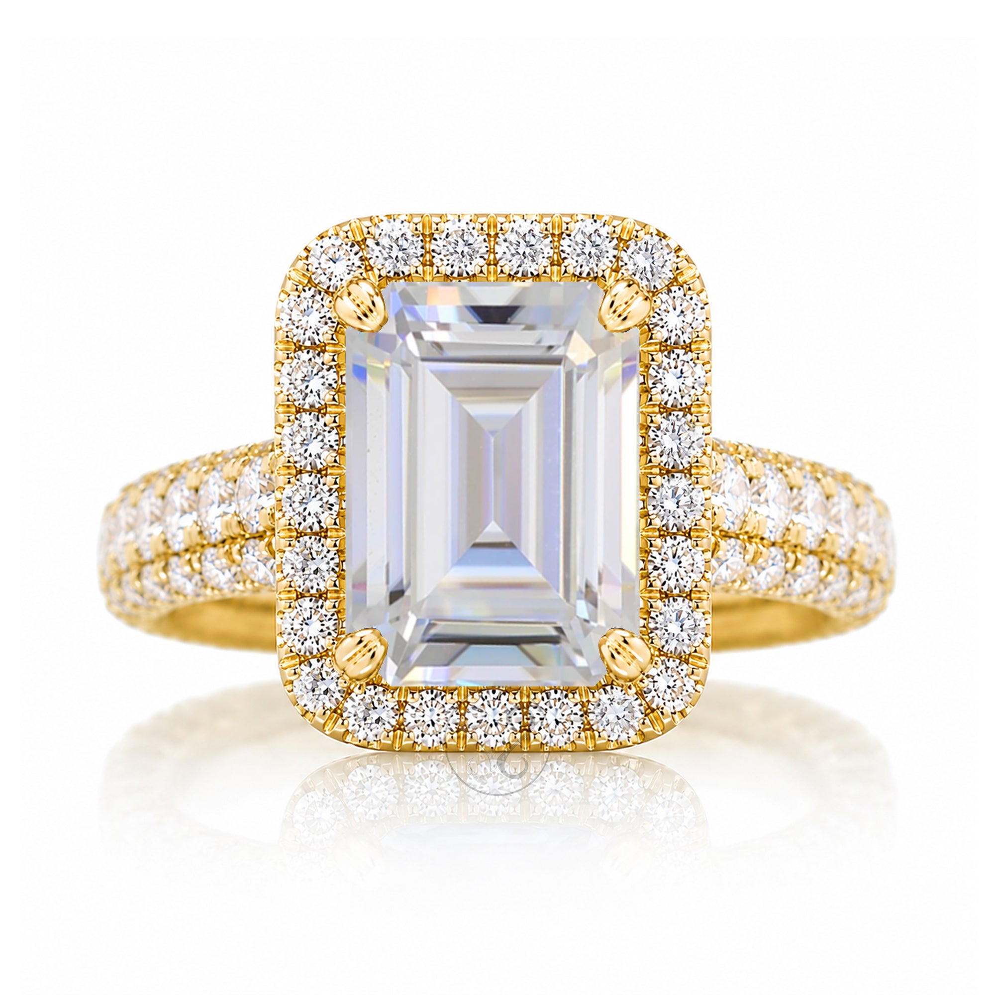 Moissanite emerald cut diamond halo and large three dimensional wide band in yellow gold