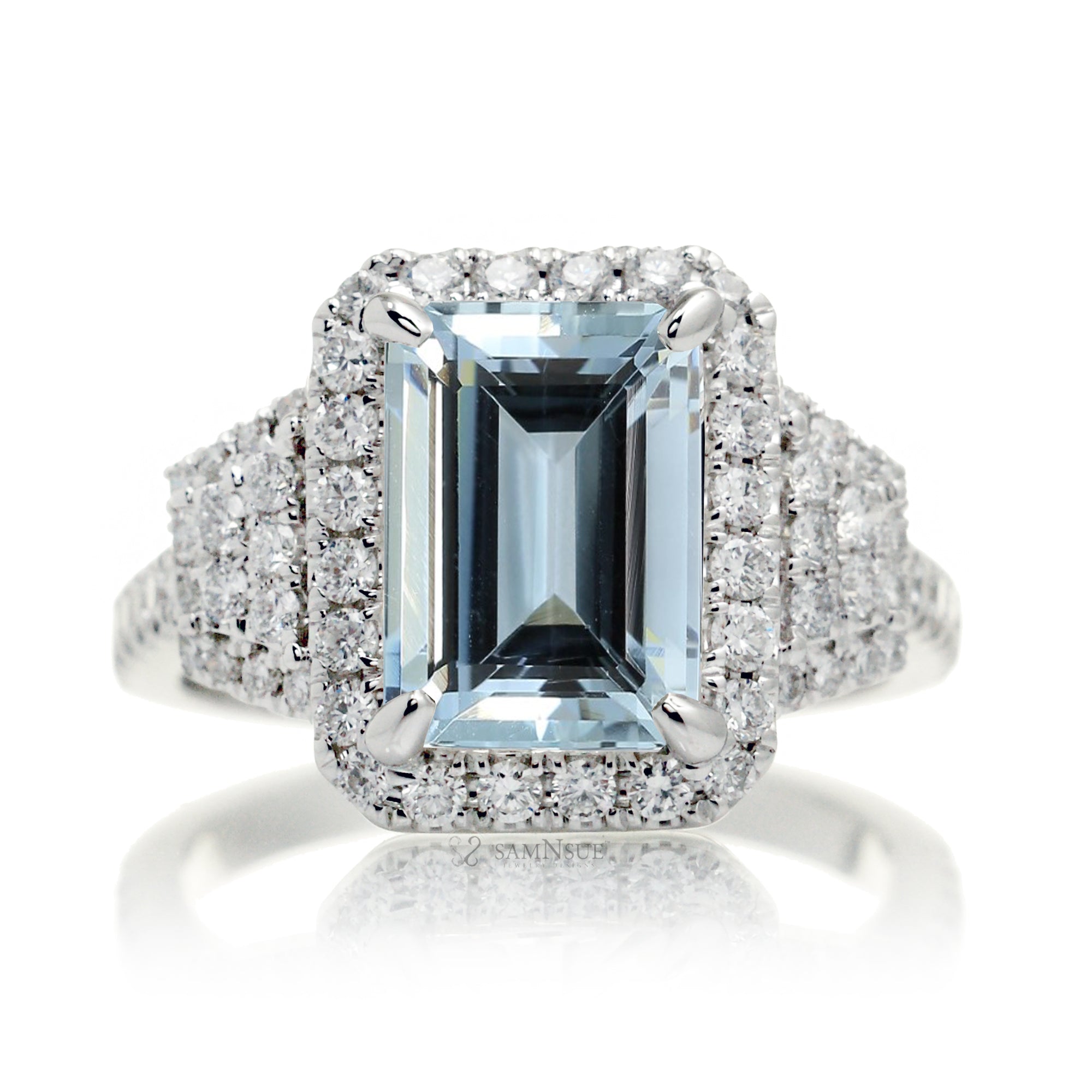Emerald cut blue aquamarine diamond halo and trapezoid three stone ring white gold