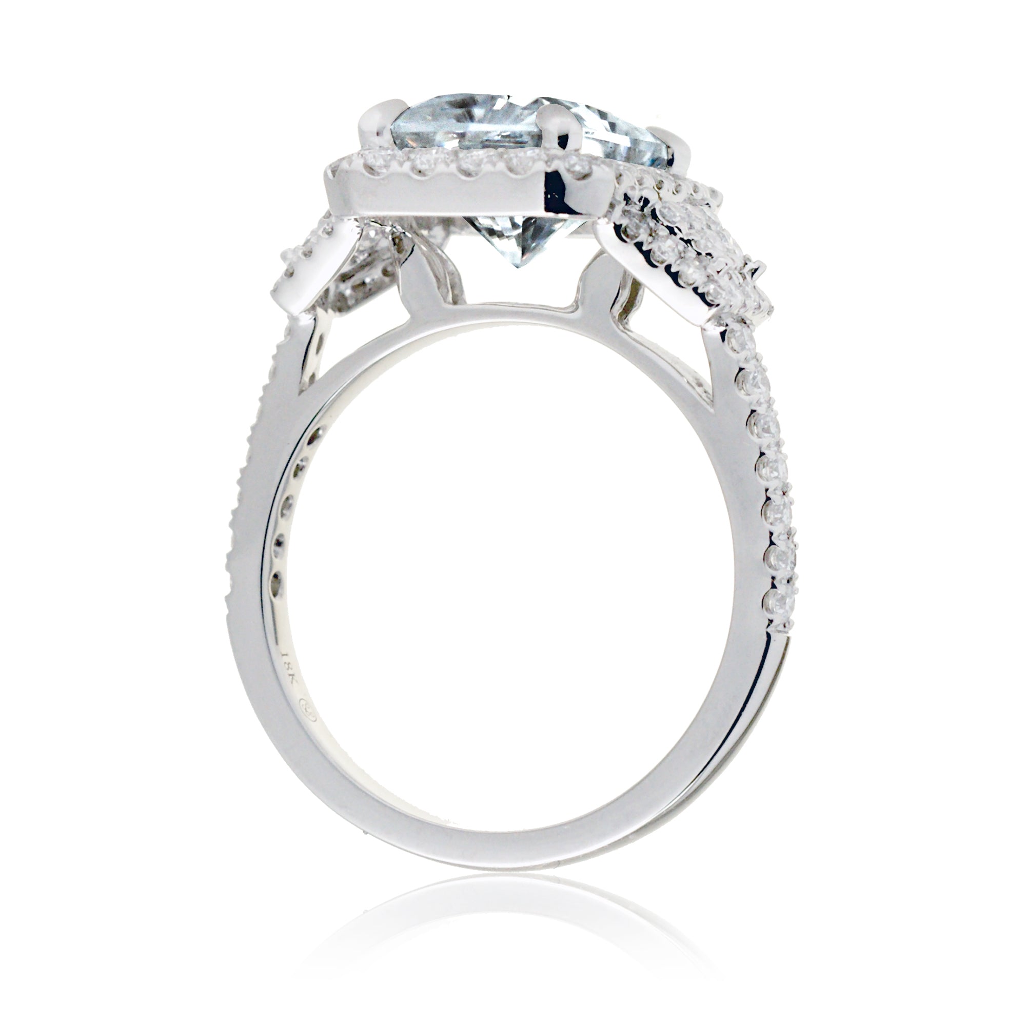 Emerald cut blue aquamarine diamond halo and trapezoid three stone ring white gold
