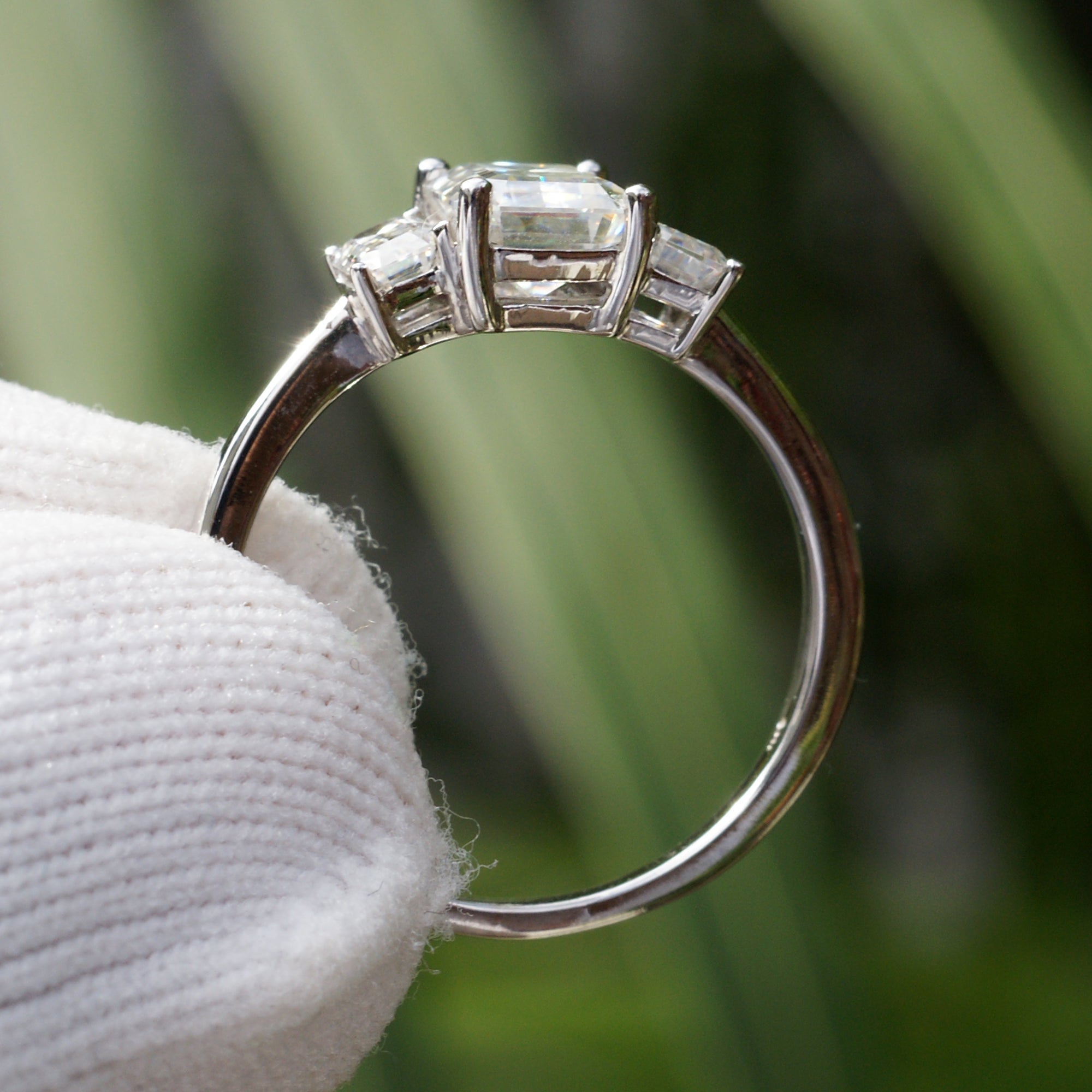 Past present future style moissanite ring in white gold with emerald cut
