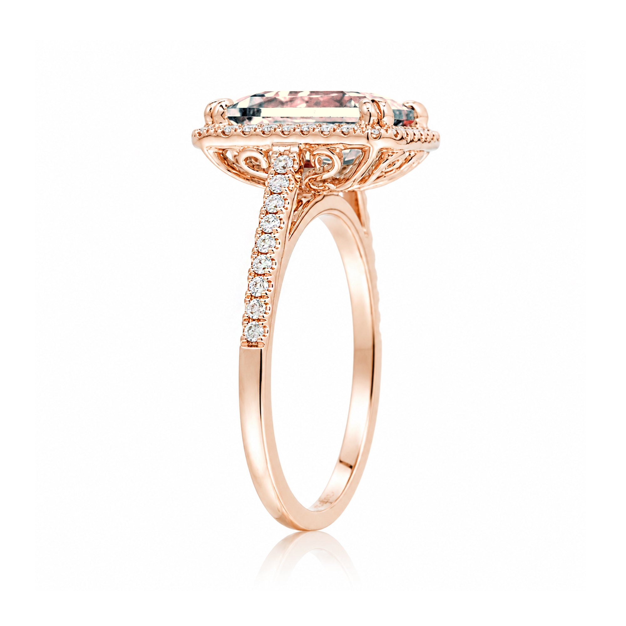 Emerald cut morganite ring with diamond halo in rose gold