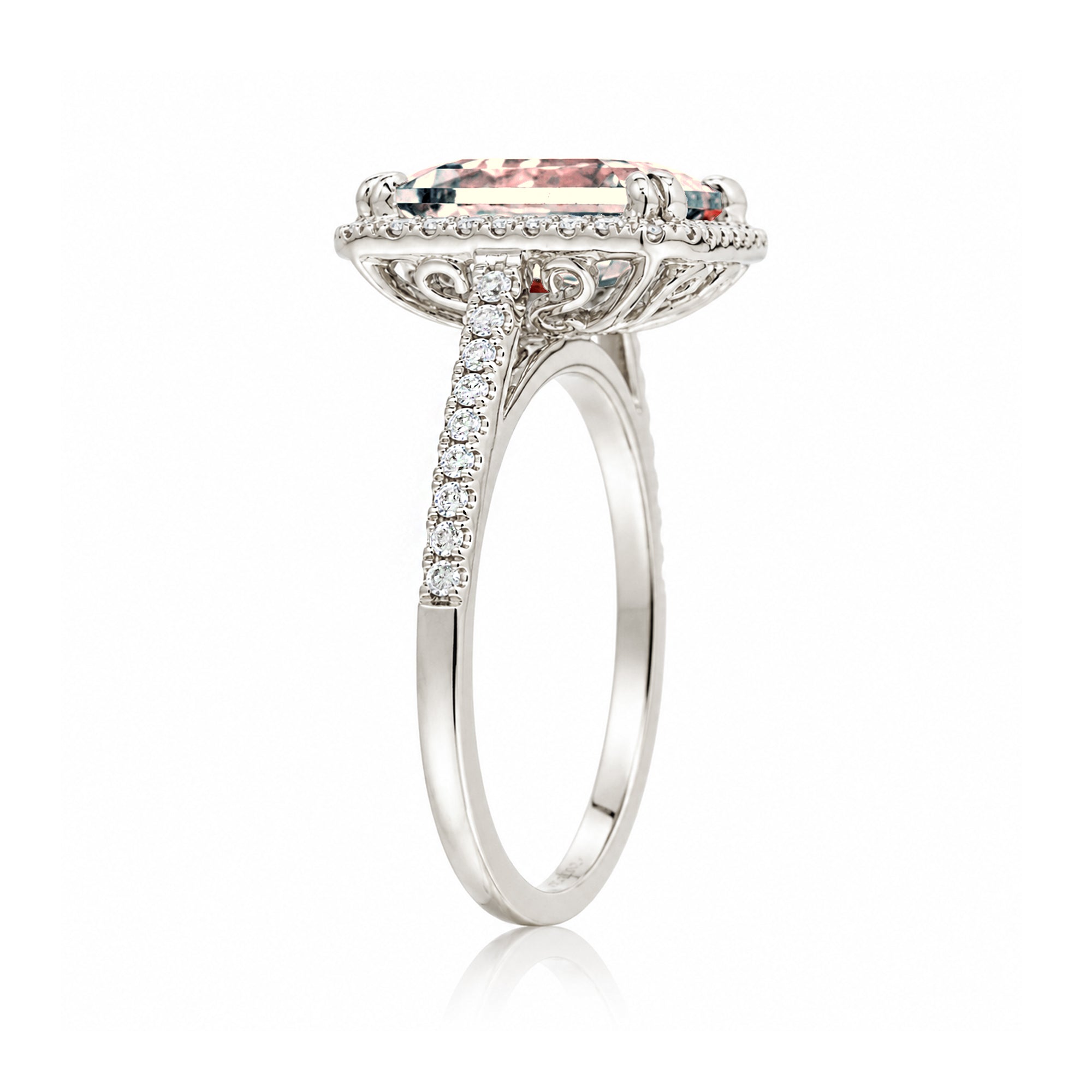 Emerald cut morganite ring with diamond halo in white gold