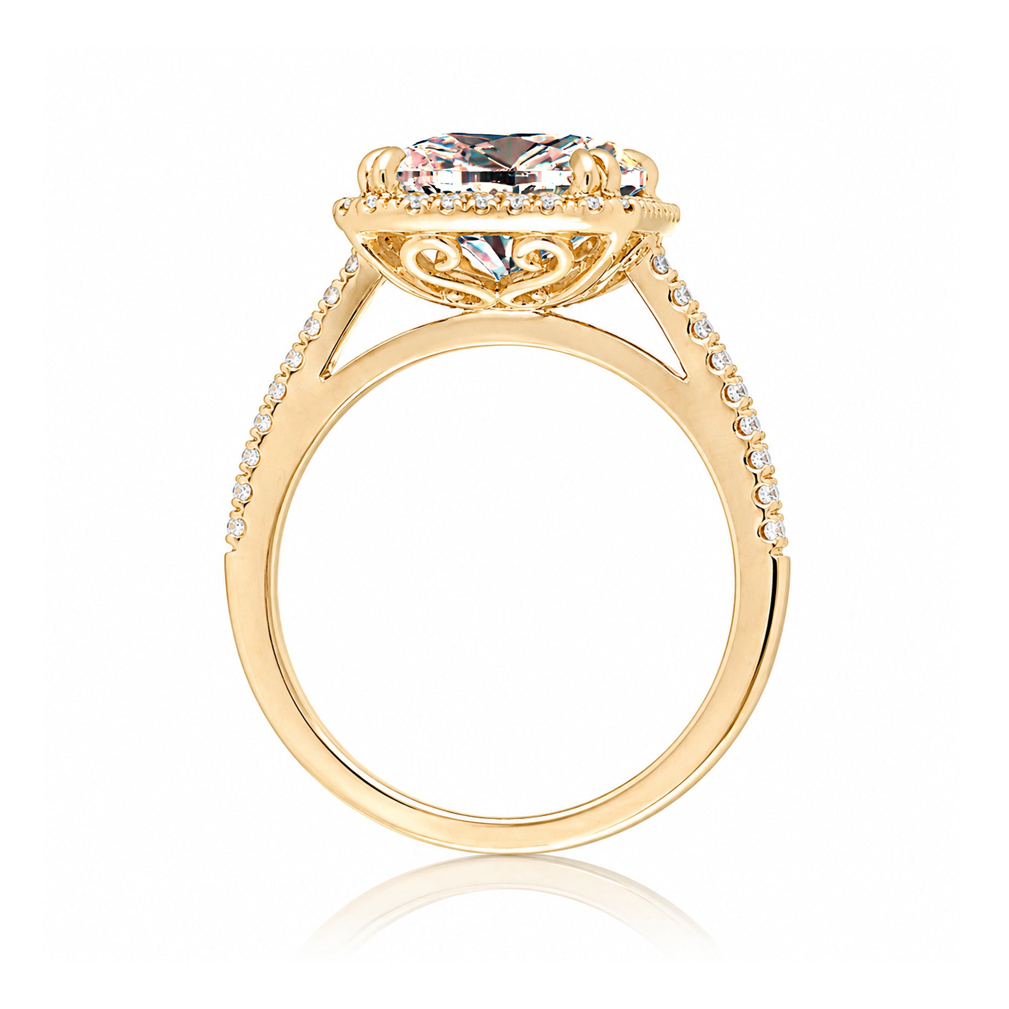 Emerald cut morganite ring with diamond halo in yellow gold
