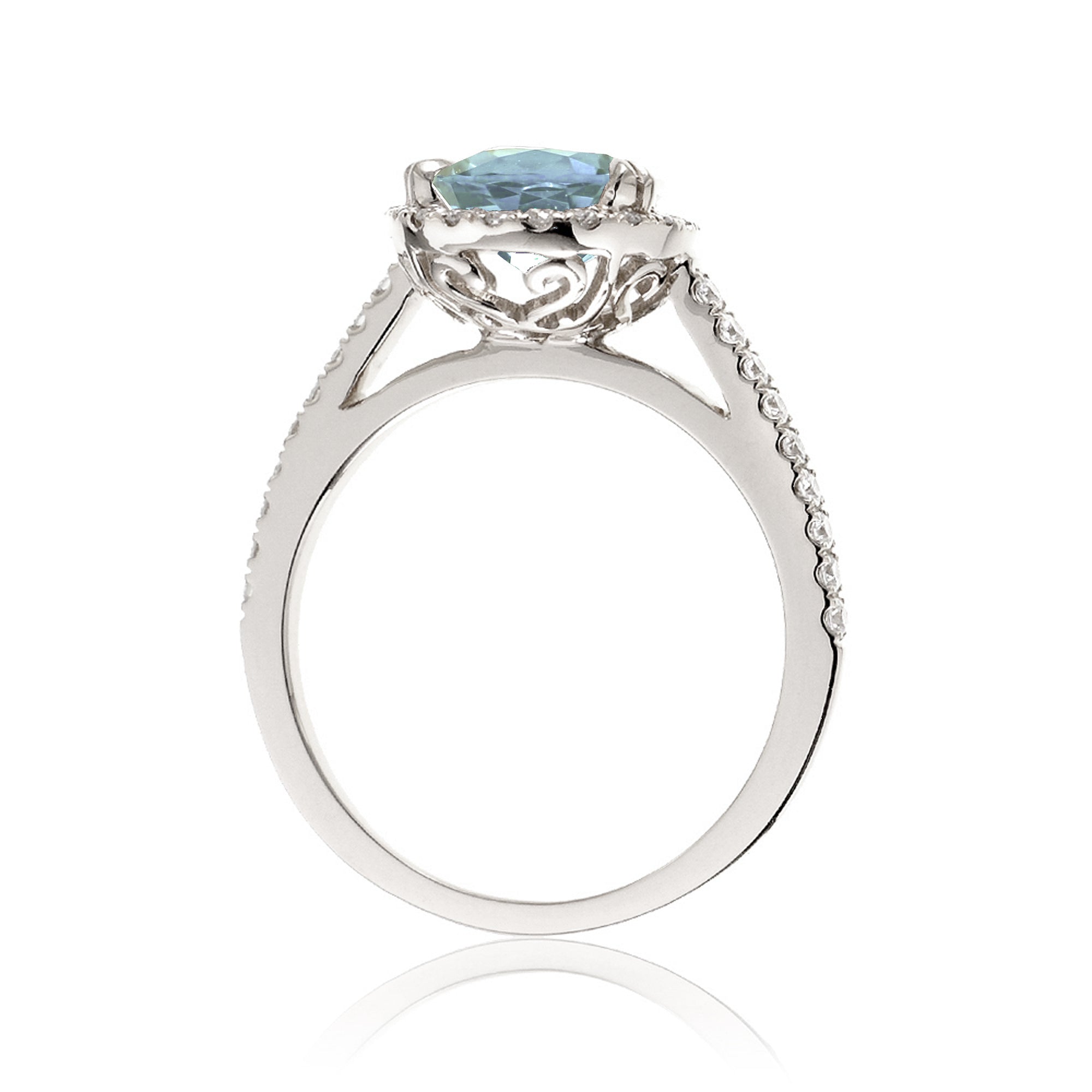 Oval cut aquamarine engagement ring with halo in white gold