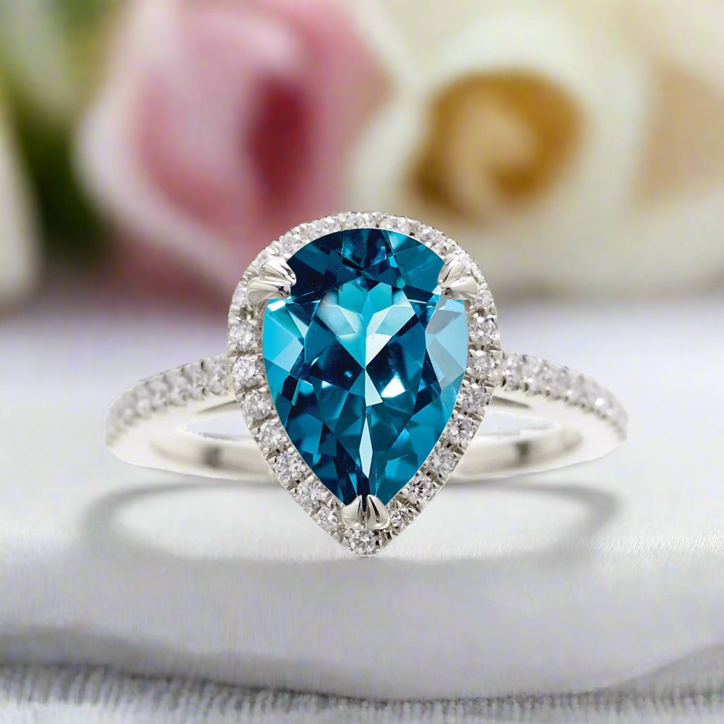 London blue topaz pear shape diamond halo engagement ring | The Signature Ring In White Gold