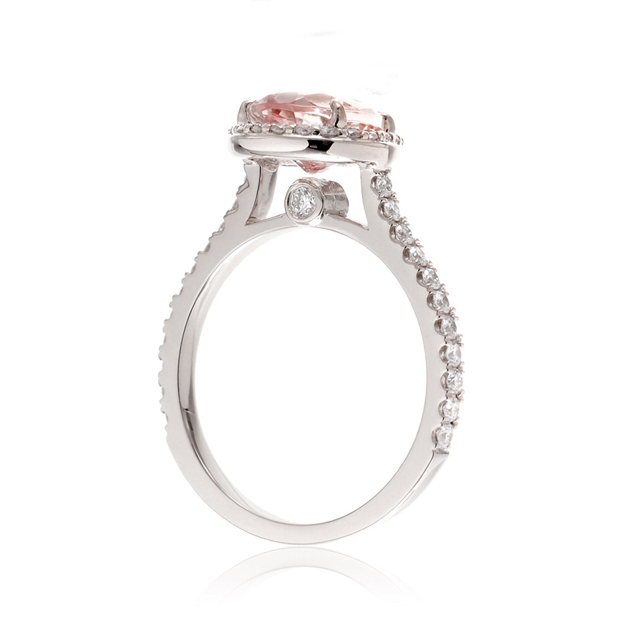 Pear cut morganite ring with diamond halo and band in the Sunset white gold