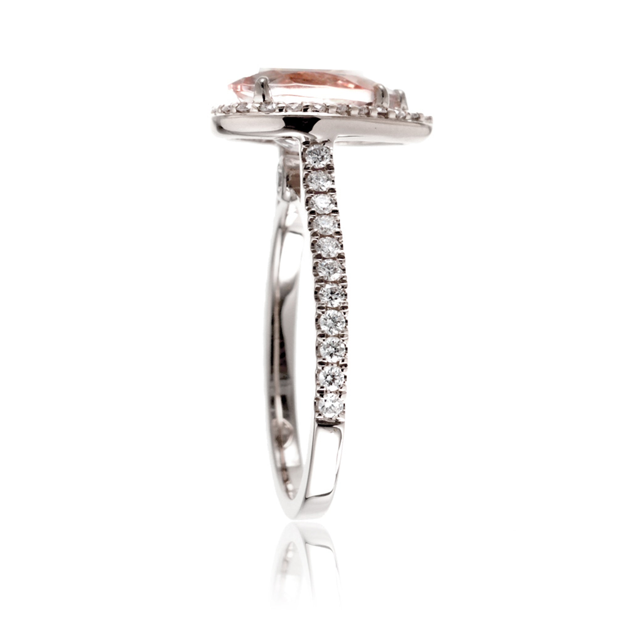 Pear cut morganite ring with diamond halo and band in the Sunset white gold