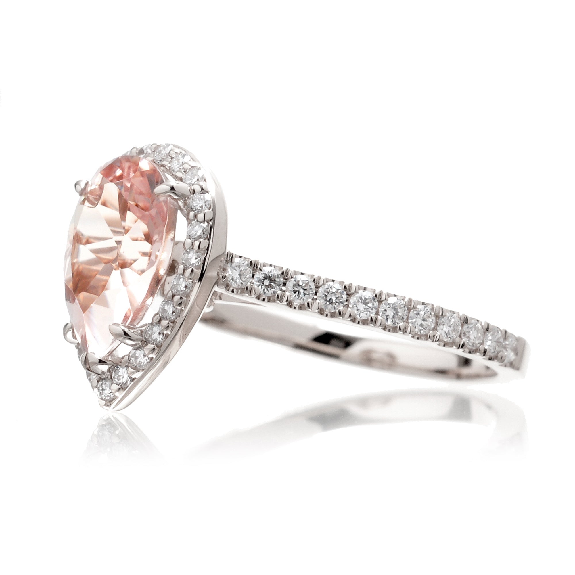 Pear cut morganite ring with diamond halo and band in the Sunset white gold