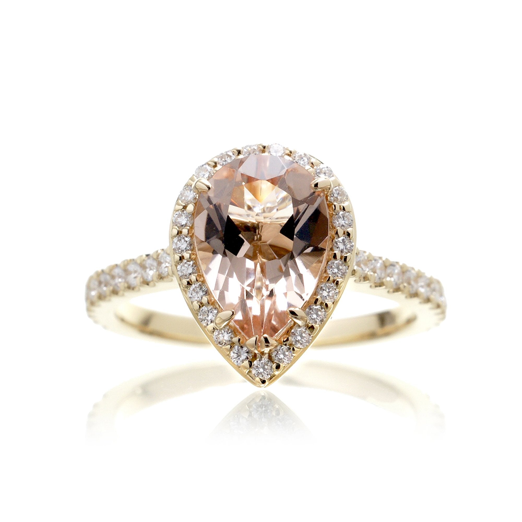 Pear cut morganite ring with diamond halo and band in the Sunset yellow gold