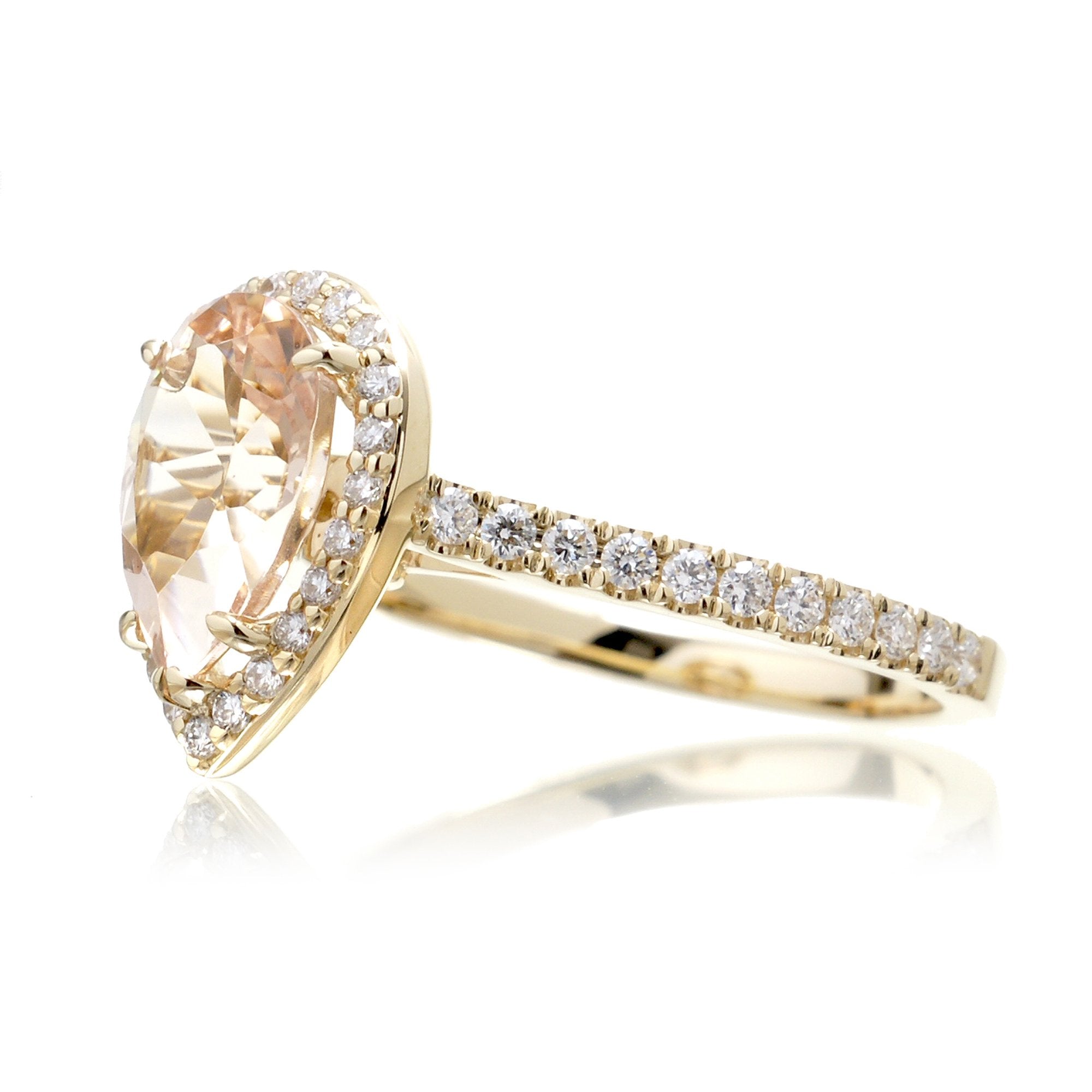 Pear cut morganite ring with diamond halo and band in the Sunset yellow gold