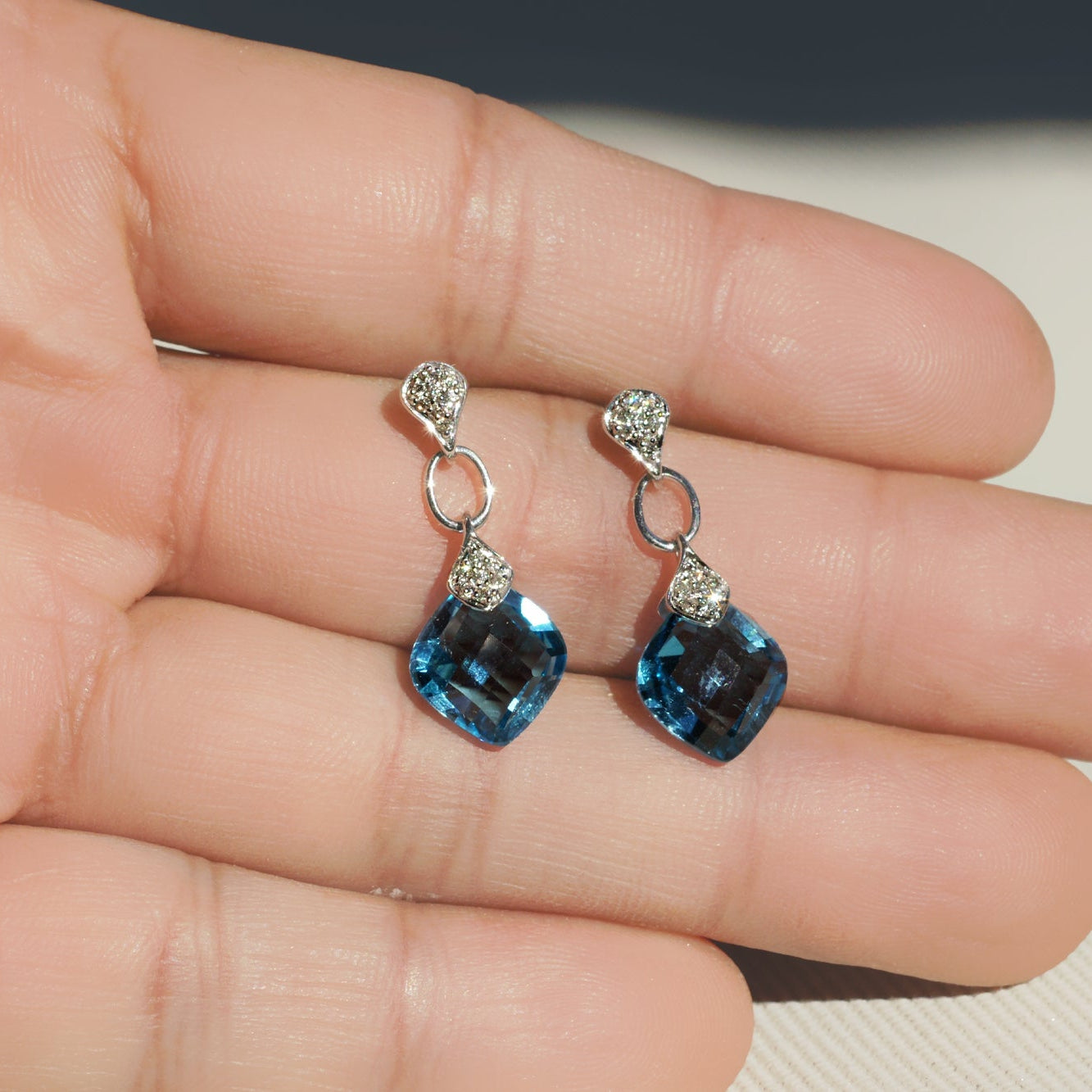 Blue topaz dangle earrings white gold