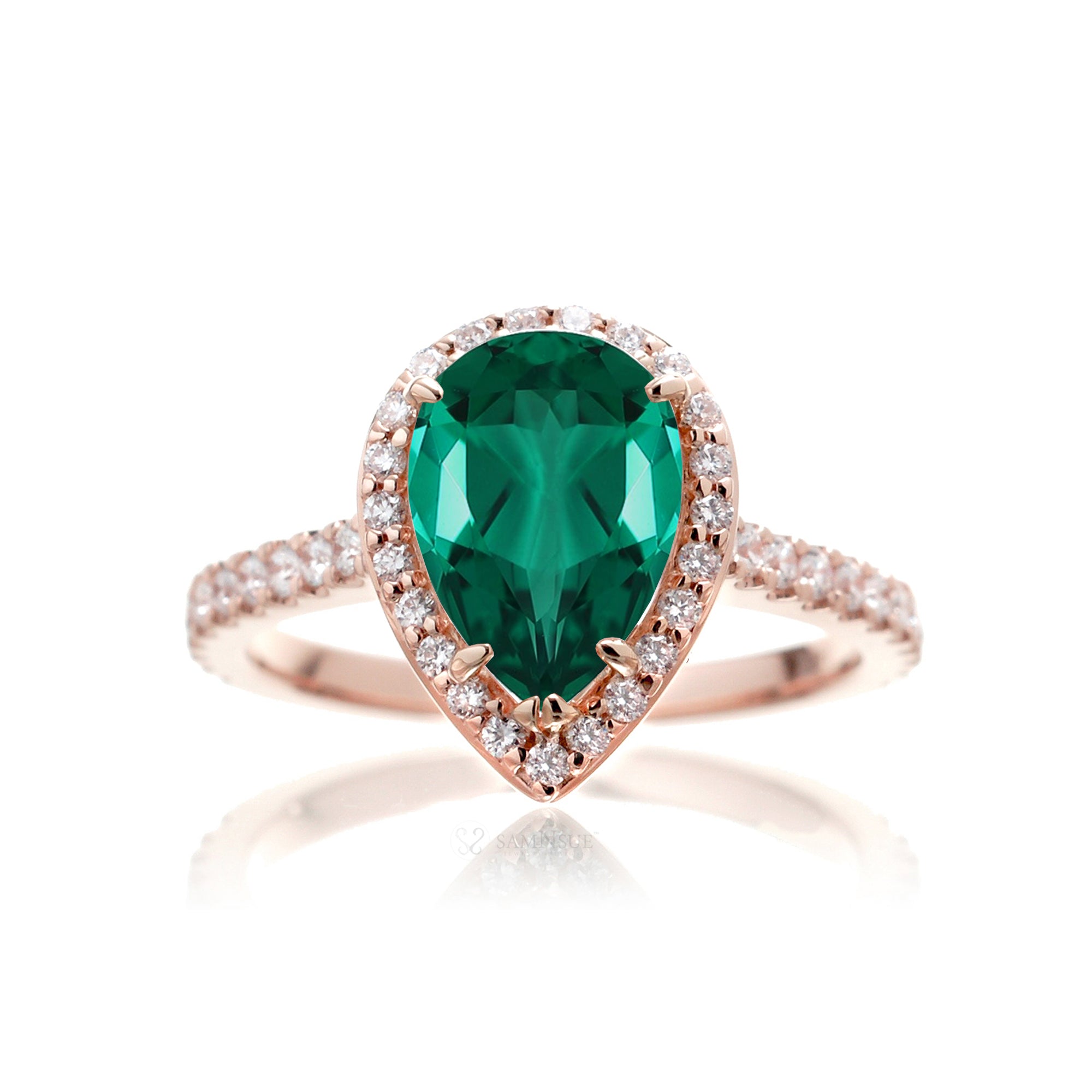 Pear emerald with diamond halo and band hidden bezel in rose gold