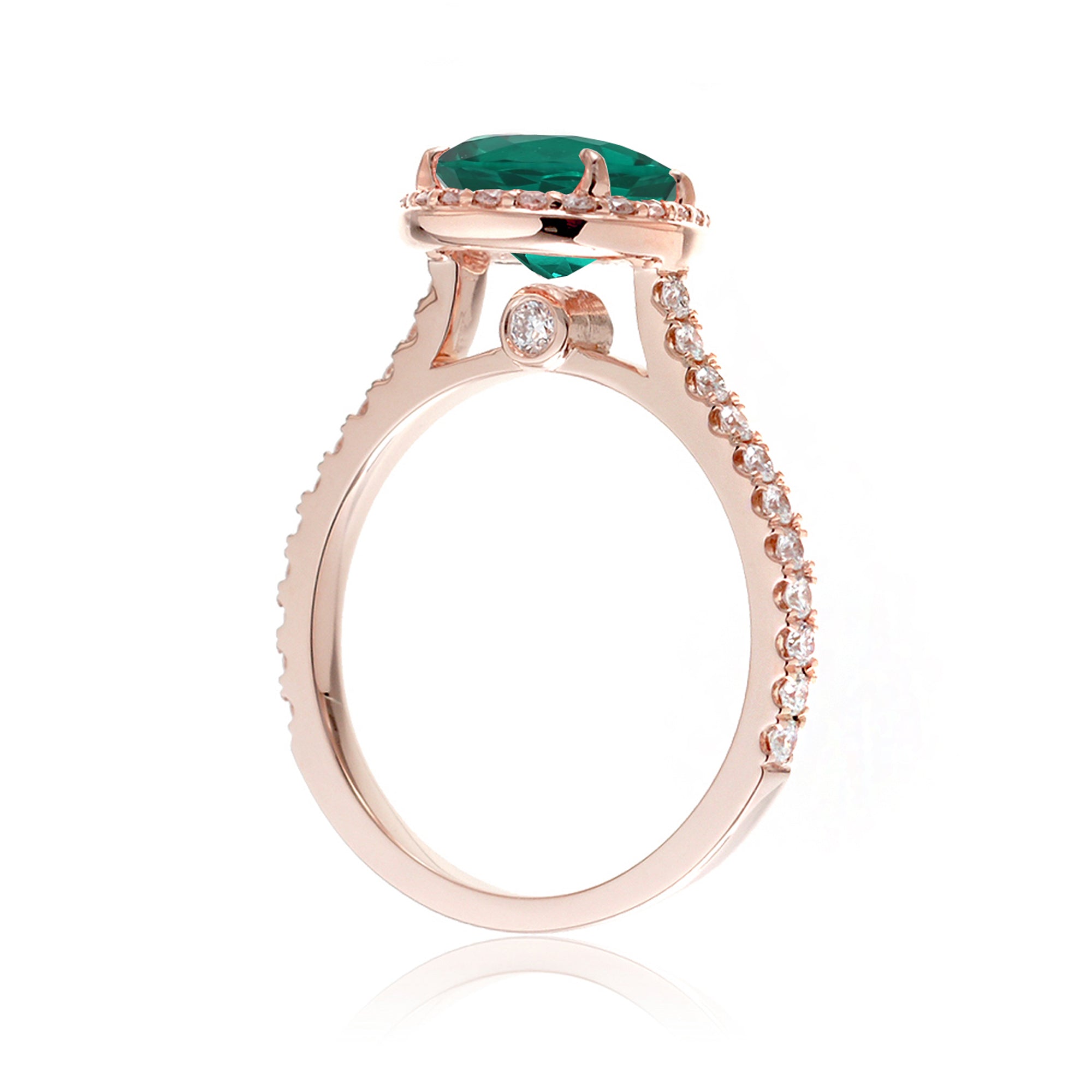 Pear emerald with diamond halo and band hidden bezel in rose gold