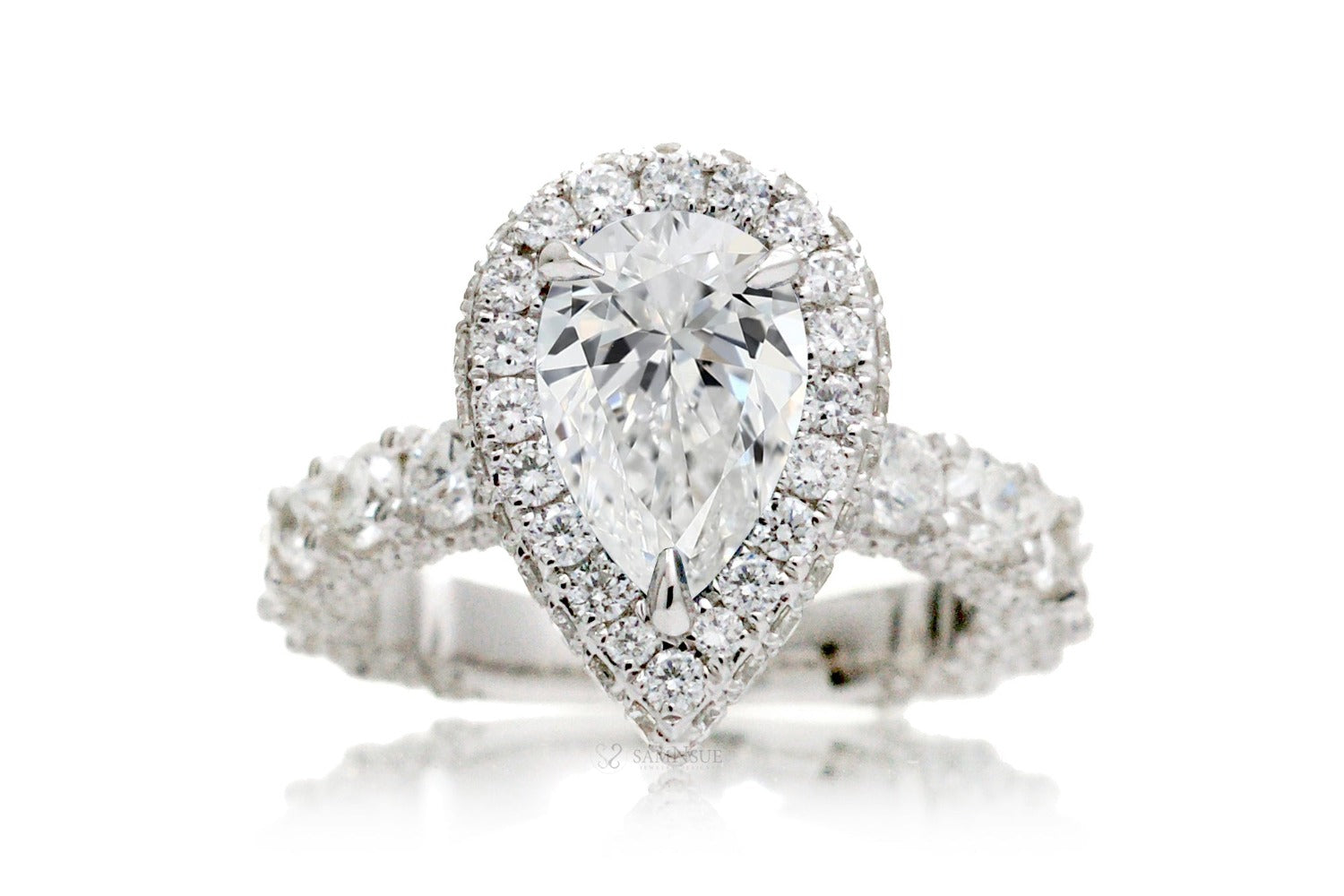 Pear diamond ring with two sided halo and u prong band