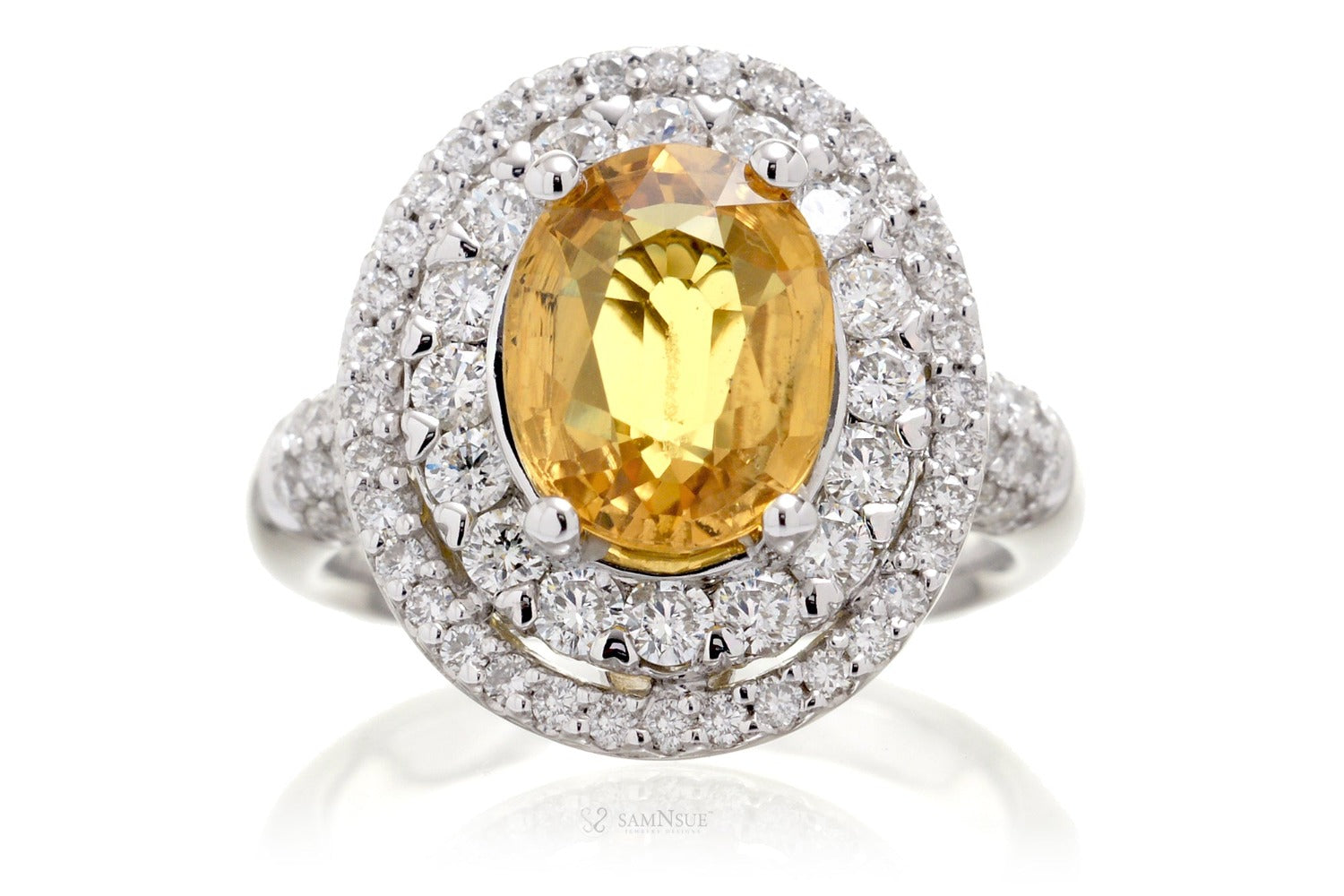Oval yellow sapphire ring with a double diamond halo in white gold