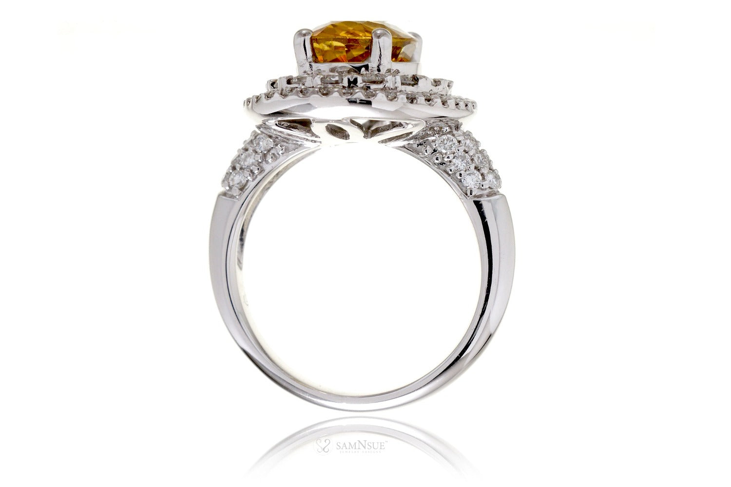 Oval yellow sapphire ring with a double diamond halo