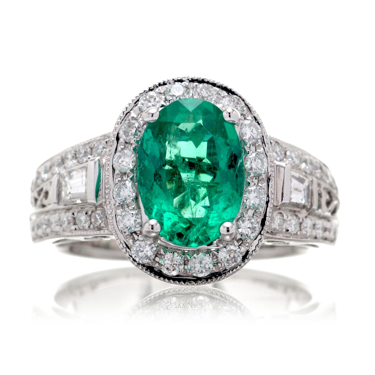 Emerald ring vintage style halo with milgrain and baguette on wide band in white gold