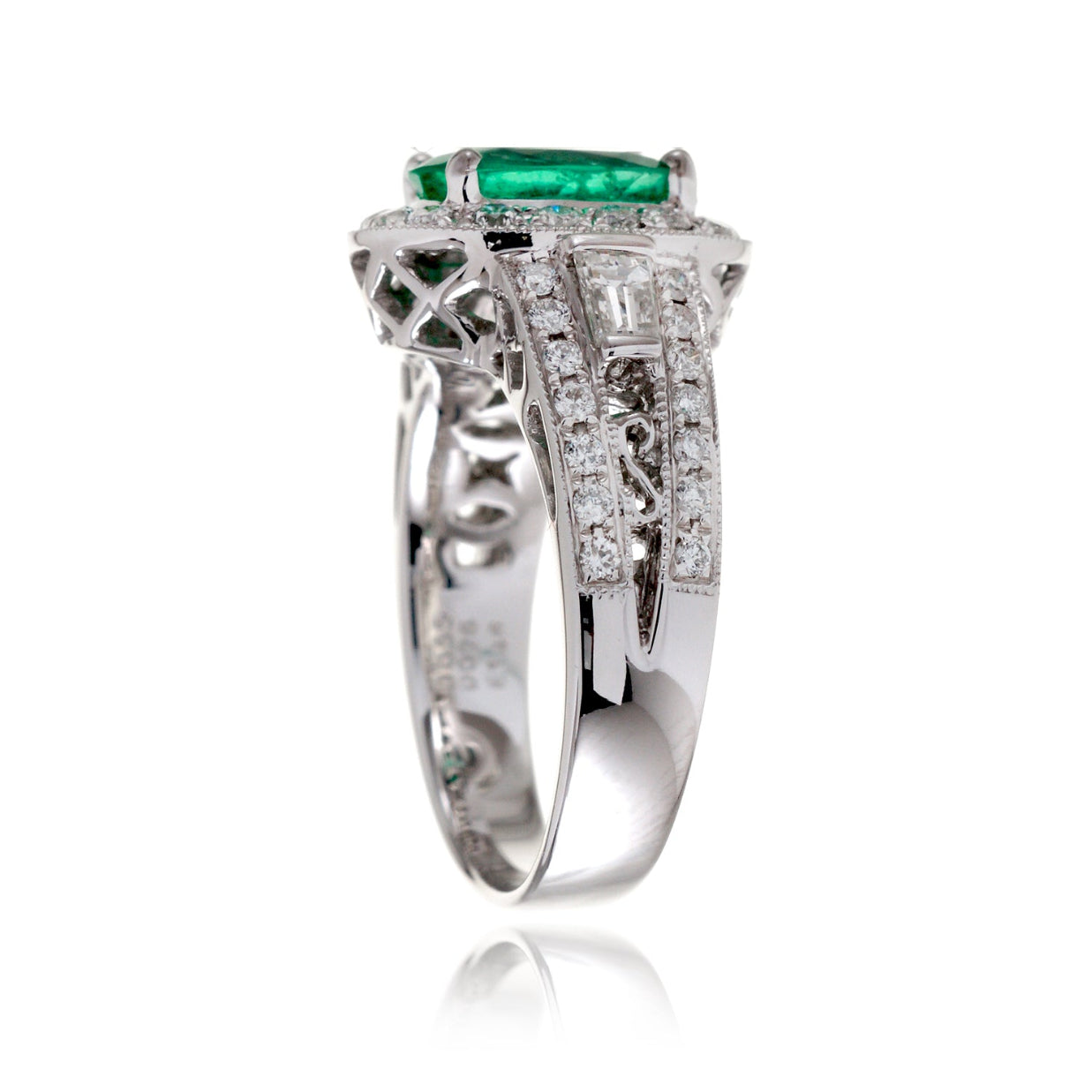 Emerald ring vintage style halo with milgrain and baguette on wide band in white gold