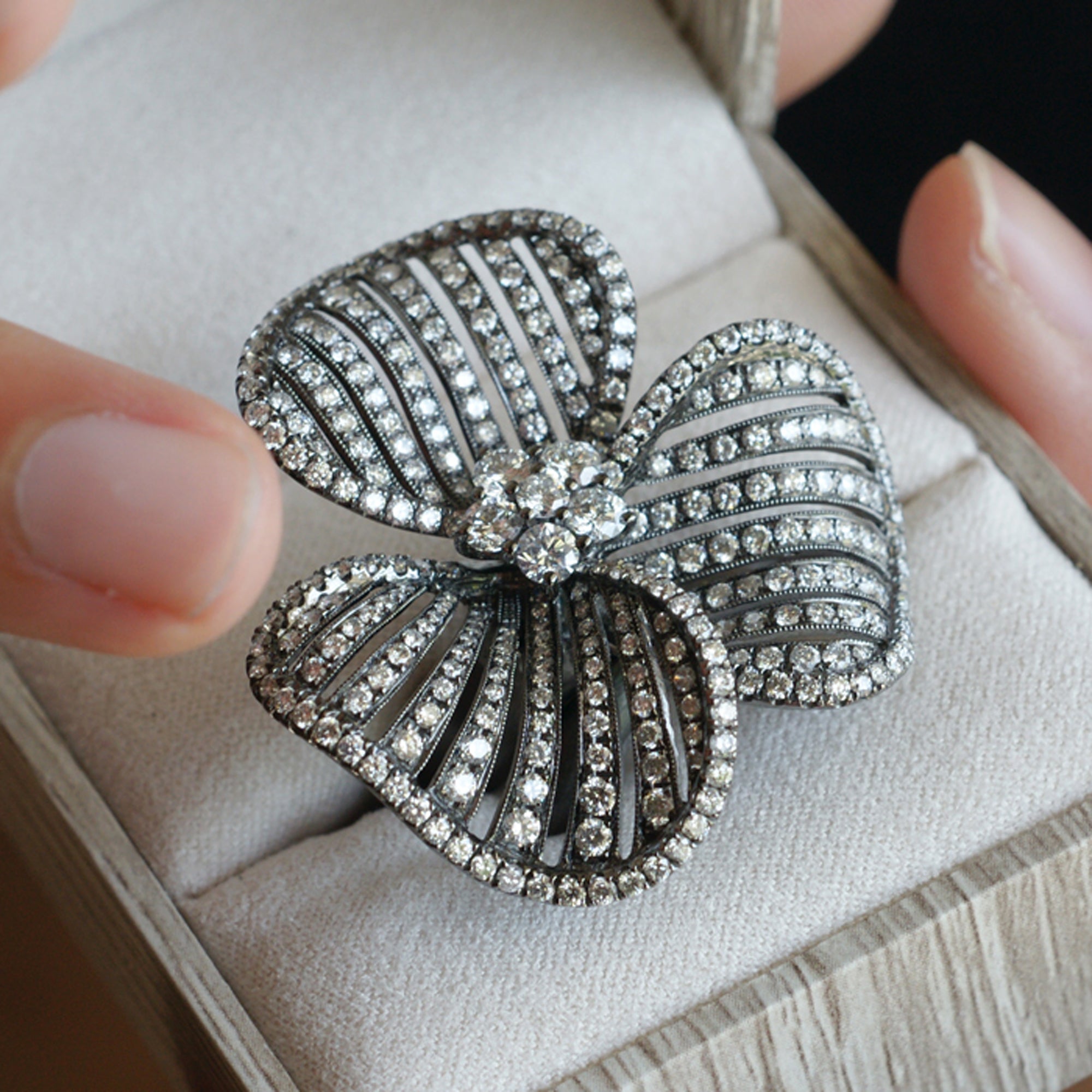 Three petal flower diamond ring cocktail with black rhodium in white gold