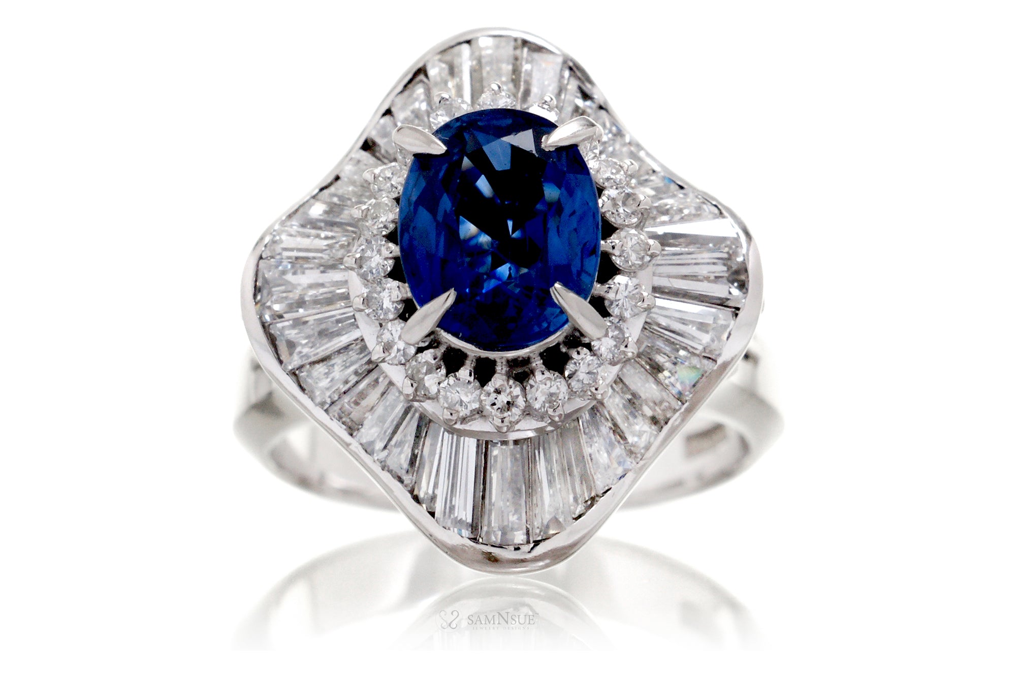 Woman vintage style sapphire engagement ring with diamond ballerina baguettes