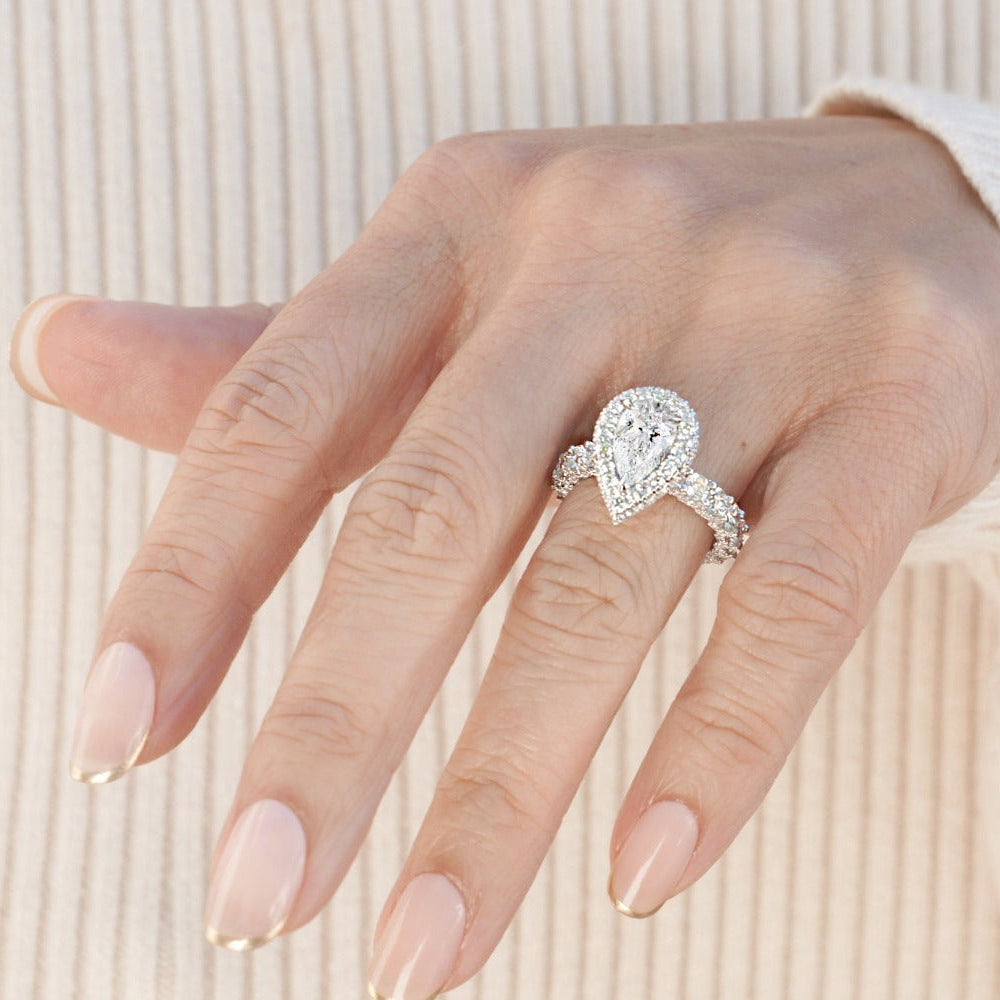 Pear 1.5ct diamond ring with two sided halo and u prong band