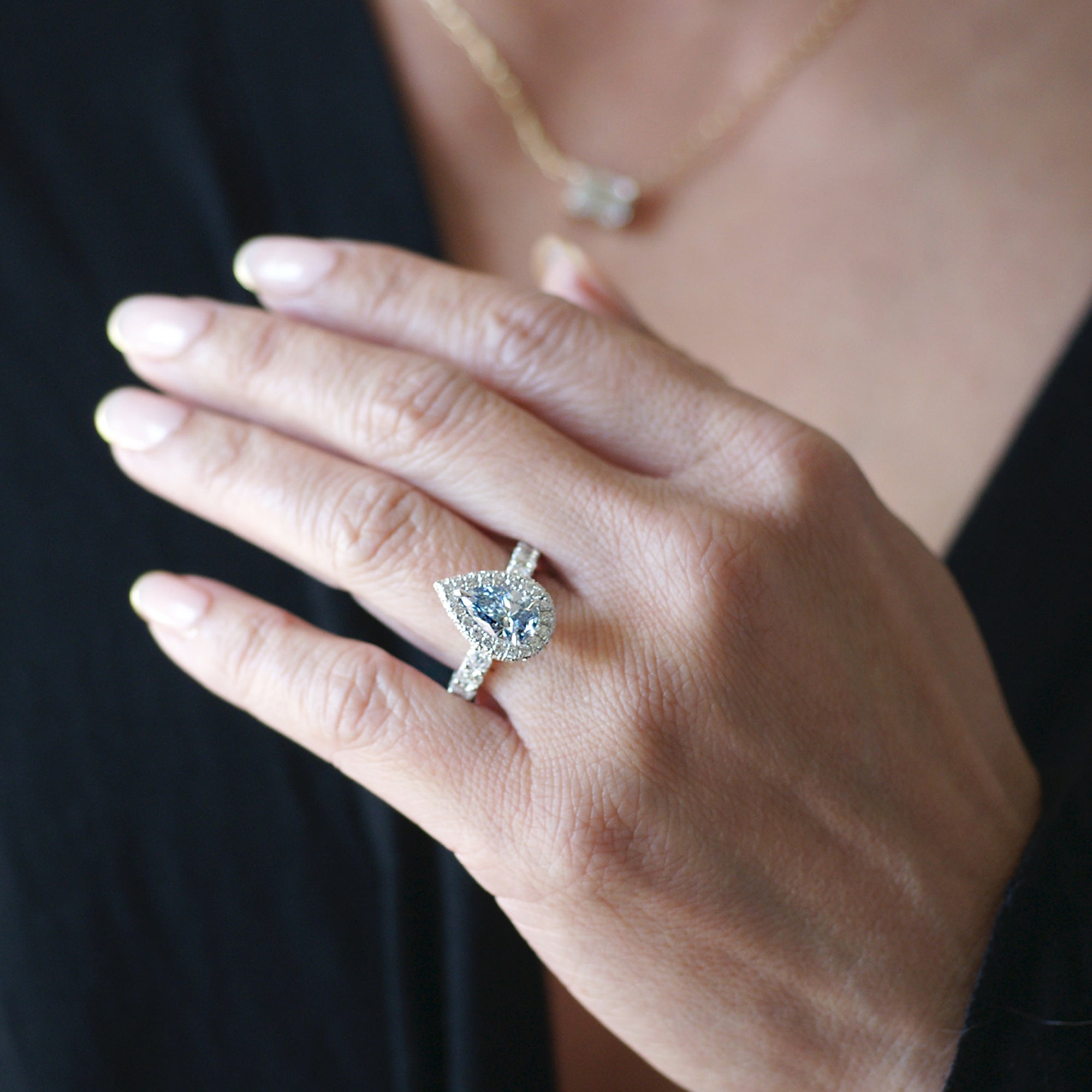 Fancy color blue diamond pear shape diamond halo hidden gem engagement ring lab-grown
