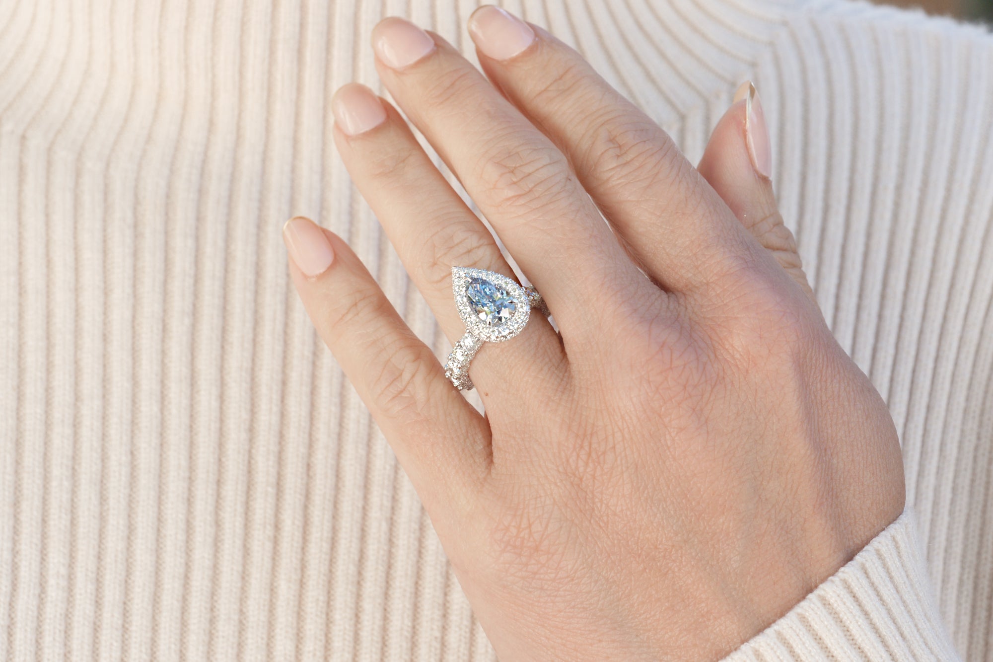 pear blue diamond engagement ring in white gold