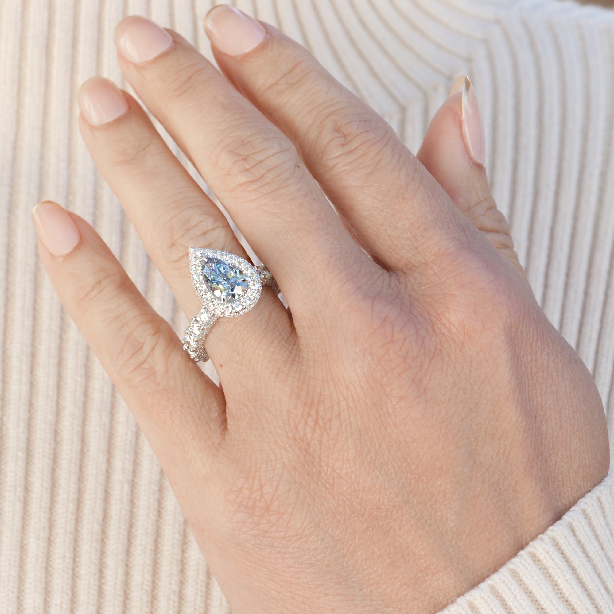 Fancy color blue diamond pear shape diamond halo hidden gem engagement ring lab-grown